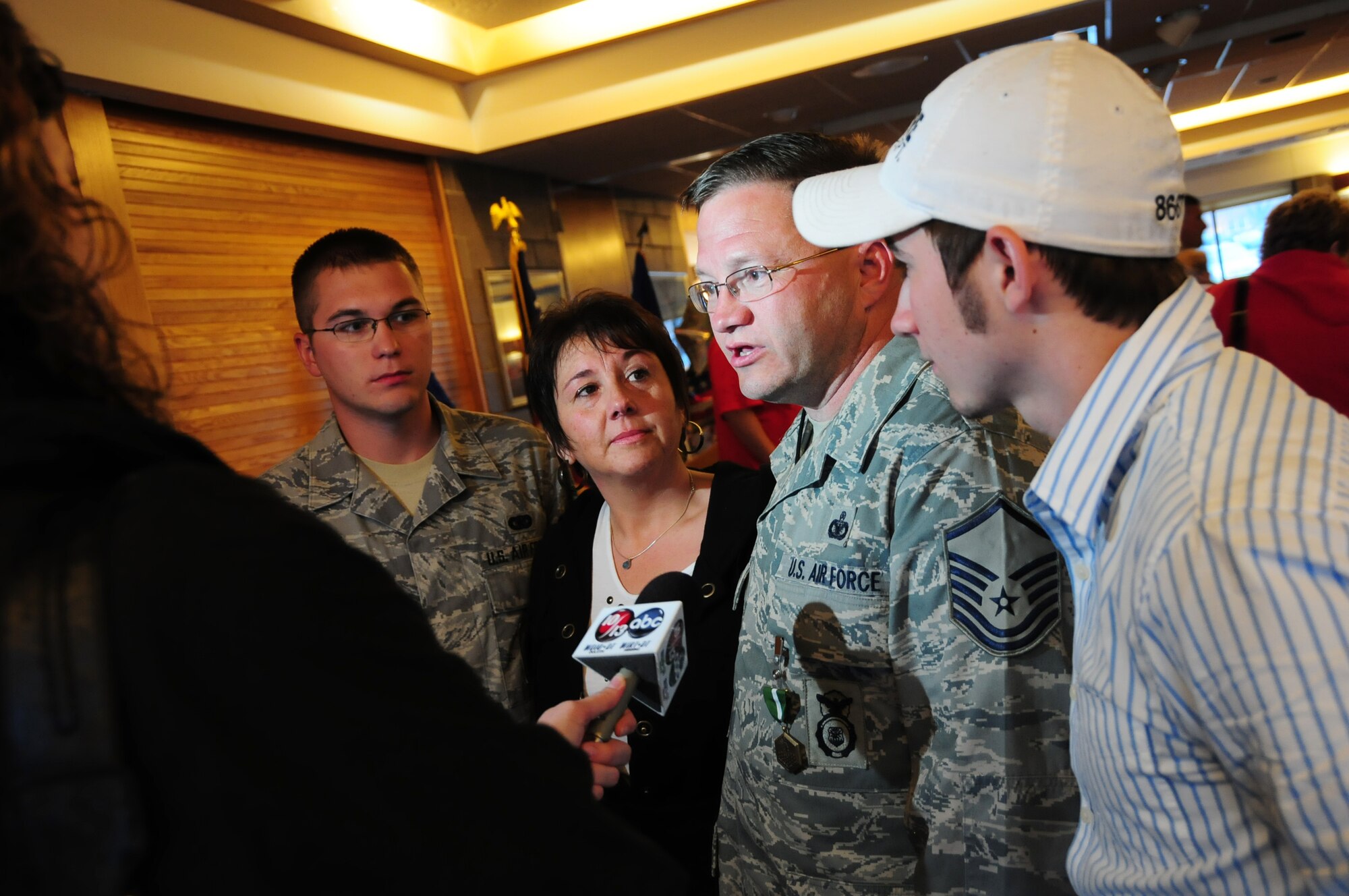 U.S. Air Force Master Sgt. William Hawley, 148th Fighter Wing Security Forces, speaks with a reporter after being reunited with his family at the Duluth, Minn., Air National Guard base May 13, 2010. Approximately 35 Air National Guard members of the 148th Fighter Wing Security Forces Squadron returned to Duluth, Minn., after a 6-month deployment in southwest Asia. (U.S. Air Force photo by Master Sgt. Jason W. Rolfe/Released)