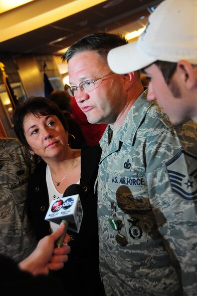 U.S. Air Force Master Sgt. William Hawley, 148th Fighter Wing Security Forces, speaks with a reporter after being reunited with his family at the Duluth, Minn., Air National Guard base May 13, 2010. Approximately 35 Air National Guard members of the 148th Fighter Wing Security Forces Squadron returned to Duluth, Minn., after a 6-month deployment in southwest Asia. (U.S. Air Force photo by Master Sgt. Jason W. Rolfe/Released)