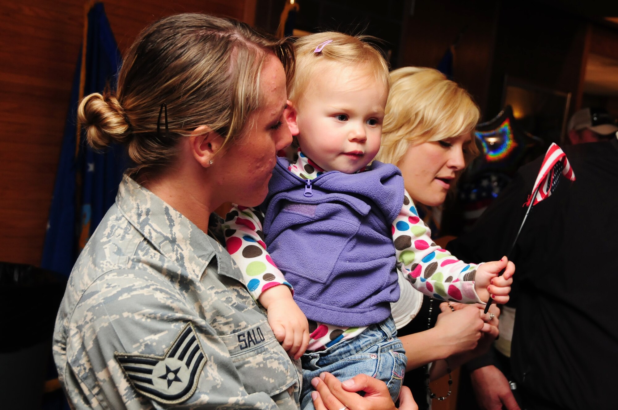 U.S. Air Force Staff Sgt. Jessica Salo, 148th Fighter Wing Security Forces, is reunited with her niece and other family members at the Duluth, Minn., Air National Guard base May 13, 2010. Approximately 35 Air National Guard members of the 148th Fighter Wing Security Forces Squadron returned to Duluth, Minn., after a 6-month deployment in southwest Asia. (U.S. Air Force photo by Master Sgt. Jason W. Rolfe/Released) 