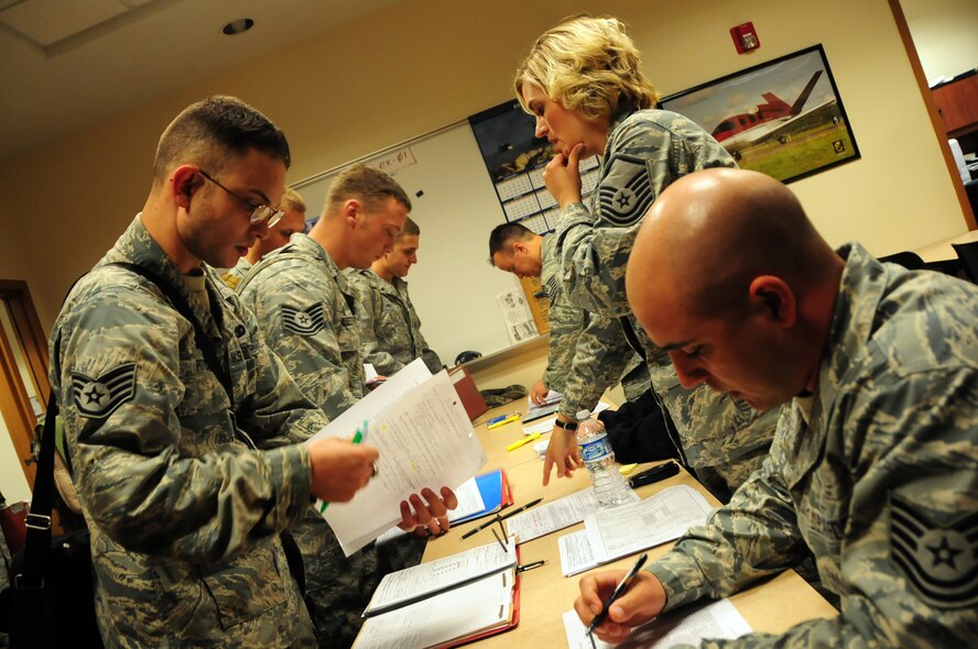 U.S. Air Force Staff Sgt. Michael Pitoscia, 148th Fighter Wing Security Forces, completes in-processing paper work after just returning to his home unit in Duluth, Minn., May 13, 2010. Approximately 35 Air National Guard members of the 148th Fighter Wing Security Forces Squadron returned to Duluth, Minn., after a 6-month deployment in southwest Asia. (U.S. Air Force photo by Master Sgt. Jason W. Rolfe/Released)