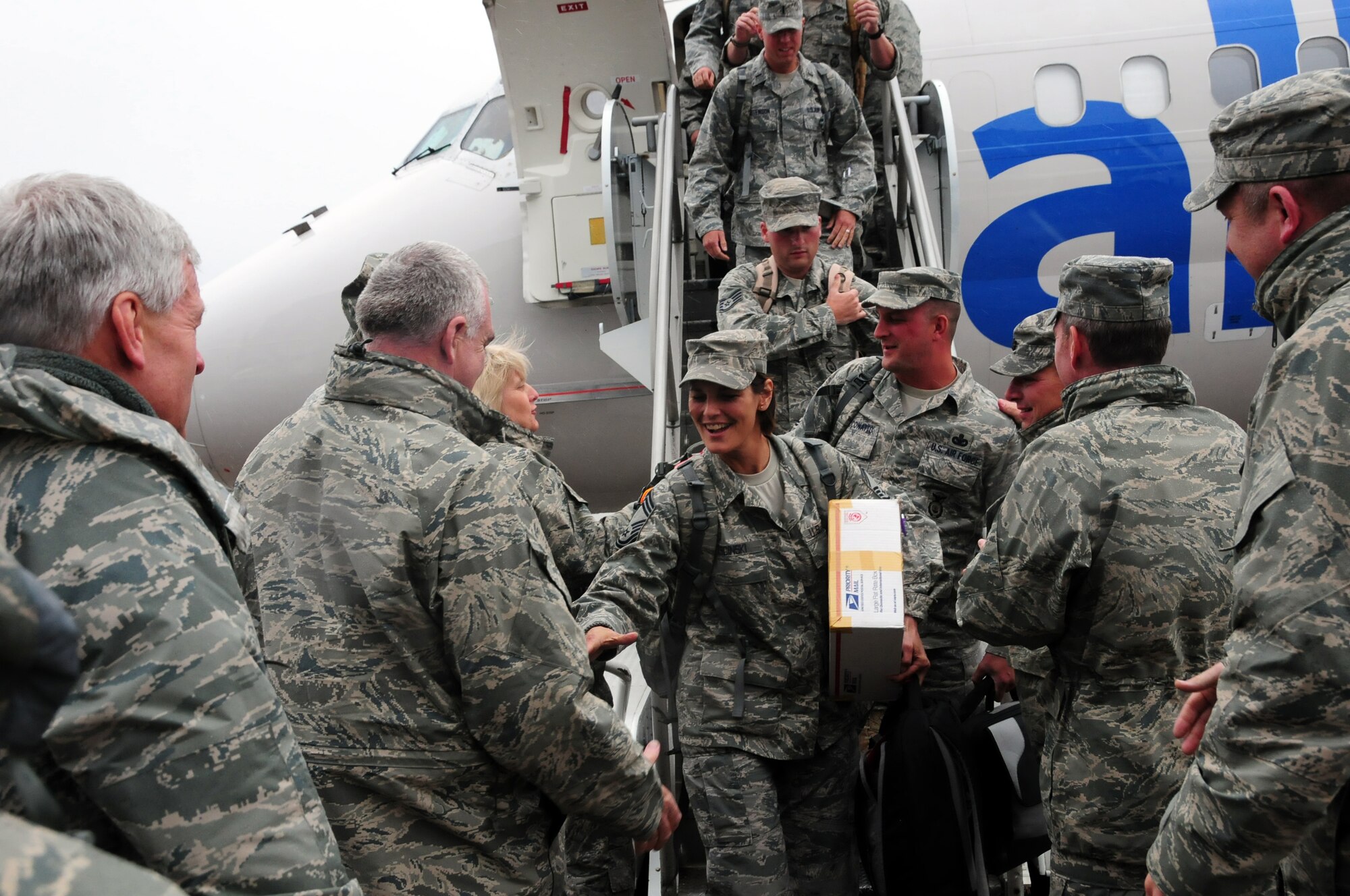U.S. Air Force Chief Master Sgt. Susan Ksicinski, Security Forces Superintendant, is greeted by wing leadership as she gets off a plane at the Duluth, Minn., International Airport May 13, 2010. Approximately 35 Air National Guard members of the 148th Fighter Wing Security Forces Squadron returned to Duluth, Minn., after a 6-month deployment in southwest Asia. (U.S. Air Force photo by Master Sgt. Jason W. Rolfe/Released)