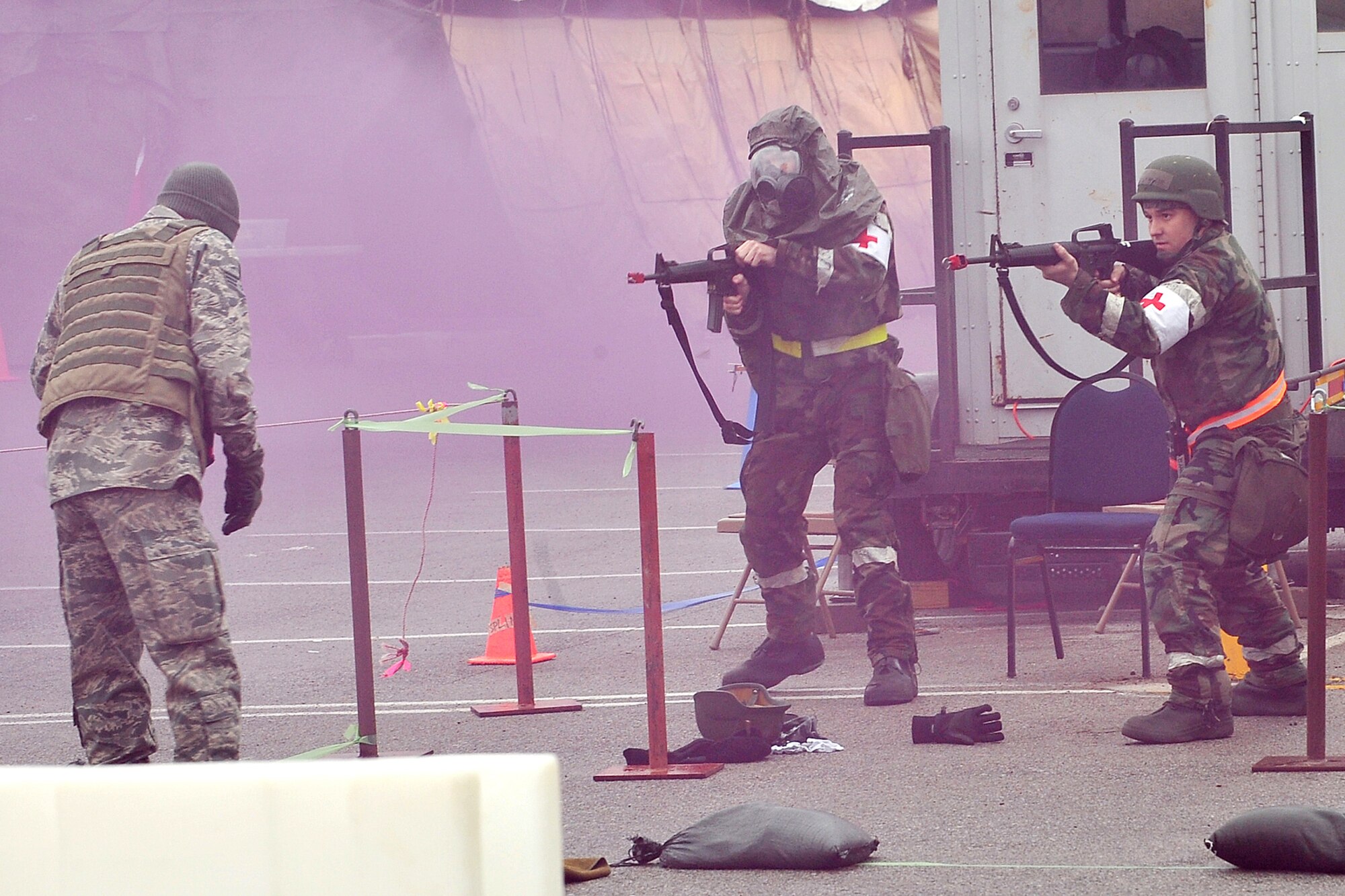 OFFUTT AIR FORCE BASE, Neb. -- Tech. Sgt. Christopher Roegler and Airman 1st Class William Brown, both with the 55th Medical Group, aim their M-4 rifles at a "terrorist suspect" during an Operational Readiness Exercise at Base X, a simulated deployed location here May 13. Members of the 55th Wing are currently participating in the exercise to test their combat skills and ability to effectively protect a deployed base from attack. U.S. Air Force Photo/Charles Haymond