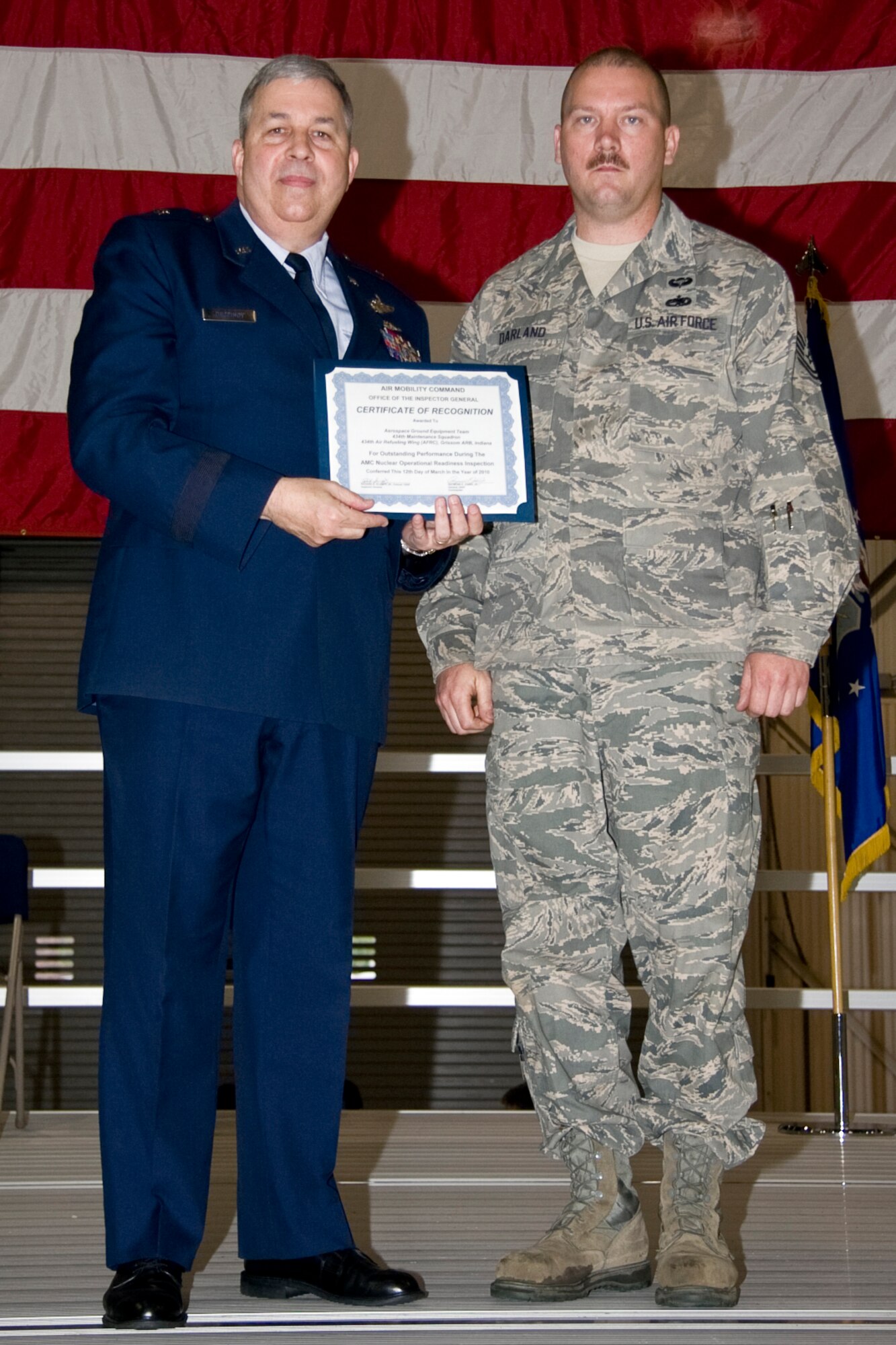GRISSOM AIR RESERVE BASE, Ind. -- Tech. Sgt. Jason Darland, 434th Maintenance Squadron aerospace ground equipment specialist, accepts an Air Mobility Command certificate of recognition for outstanding performance with an AGE team who participated in a nuclear operational readiness inspection recently. The certificate was presented by Brig. Gen. Dean Despinoy, 434th Air Refueling Wing commander, during a commander's call held in May. (U.S. Air Force photo/Tech. Sgt. Mark R. W. Orders-Woempner)