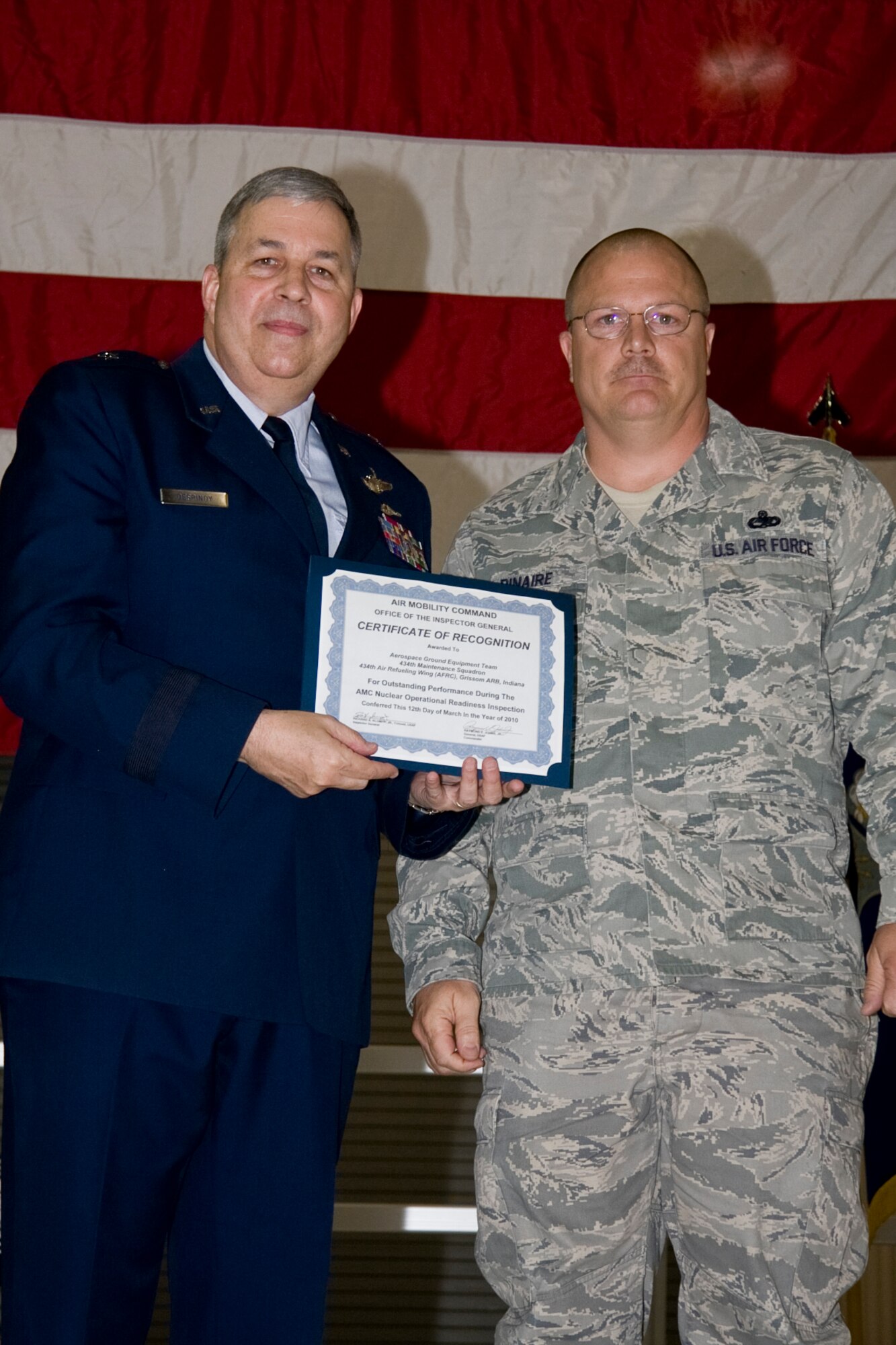 GRISSOM AIR RESERVE BASE, Ind. -- Master Sgt. Kenneth Pinaire, 434th Maintenance Squadron aerospace ground equipment specialist, accepts an Air Mobility Command certificate of recognition for outstanding performance with an AGE team who participated in a nuclear operational readiness inspection recently. The certificate was presented by Brig. Gen. Dean Despinoy, 434th Air Refueling Wing commander, during a commander's call held in May. (U.S. Air Force photo/Tech. Sgt. Mark R. W. Orders-Woempner)