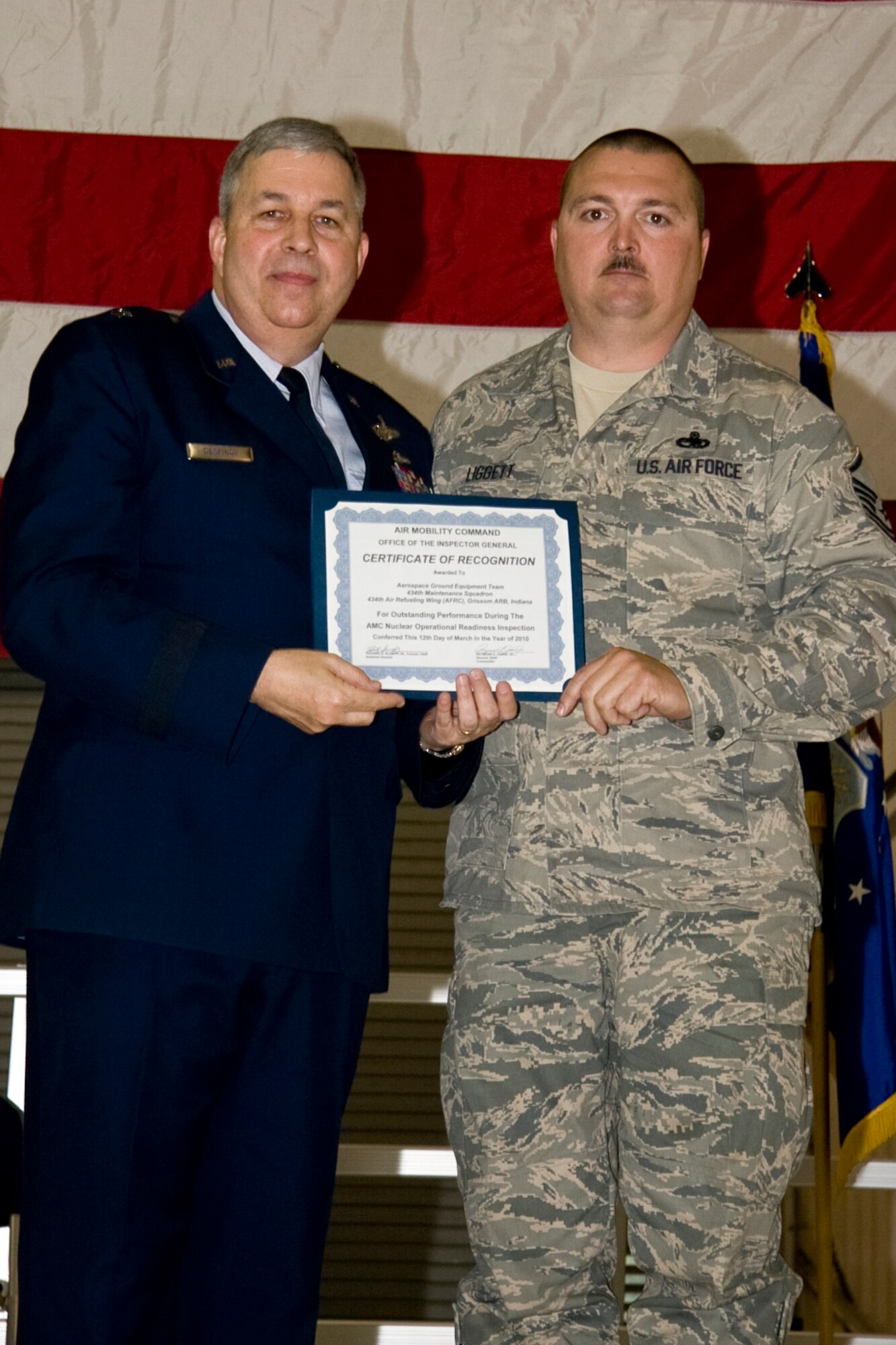 GRISSOM AIR RESERVE BASE, Ind. -- Master Sgt. Everett Liggett, Jr., 434th Maintenance Squadron aerospace ground equipment specialist, accepts an Air Mobility Command certificate of recognition for outstanding performance with an AGE team who participated in a nuclear operational readiness inspection recently. The certificate was presented by Brig. Gen. Dean Despinoy, 434th Air Refueling Wing commander, during a commander's call held in May. (U.S. Air Force photo/Tech. Sgt. Mark R. W. Orders-Woempner)