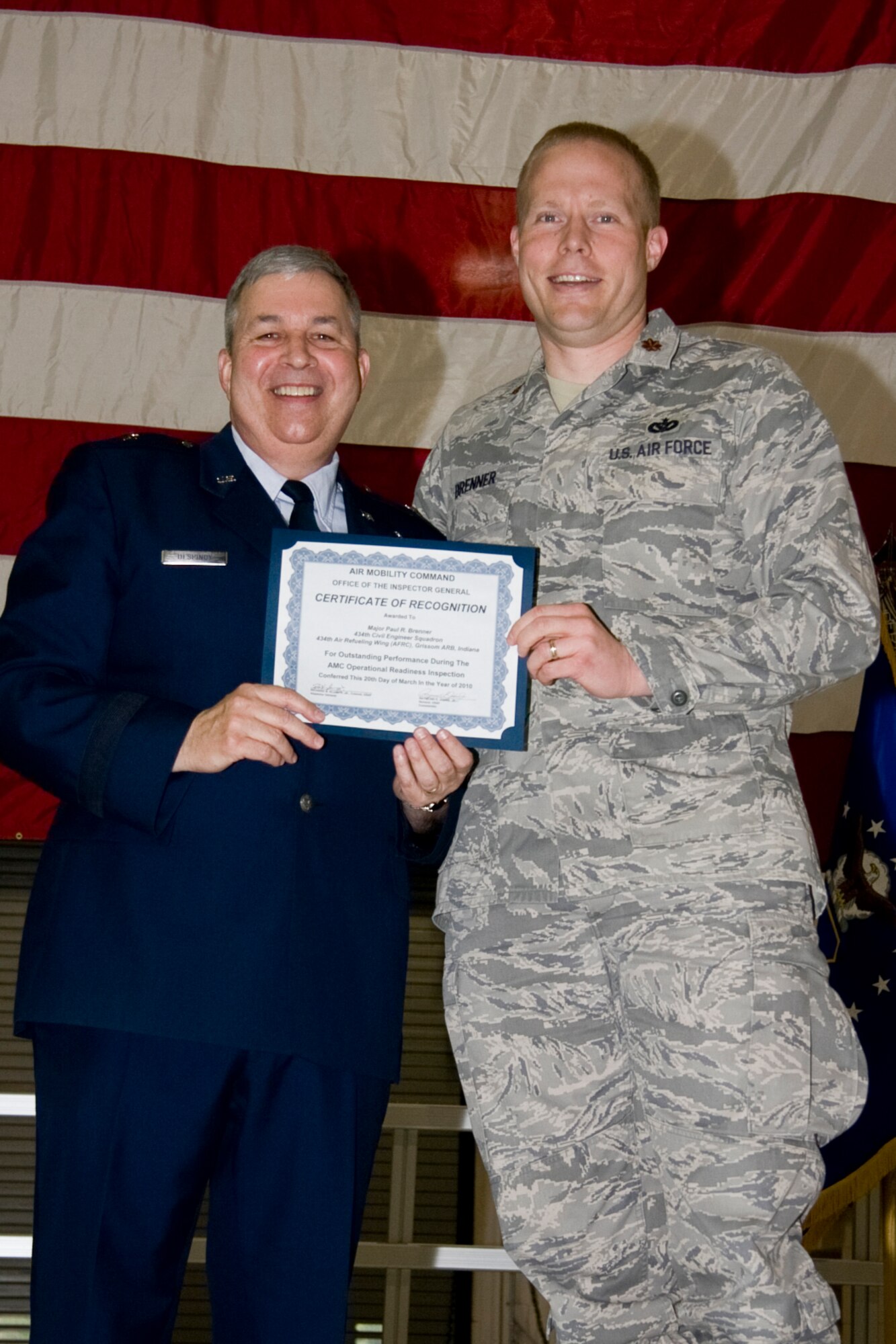 GRISSOM AIR RESERVE BASE, Ind. -- Brig. Gen. Dean Despinoy, 434th Air Refueling Wing commander, presents an Air Mobility Command certificate of recognition to Maj. Paul Brenner, 434th Civil Engineer Squadron commander. Certificates were given during a commander's call held in May to recognize outstanding performers during a recent operational readiness inspection. (U.S. Air Force photo/Tech. Sgt. Mark R. W. Orders-Woempner)