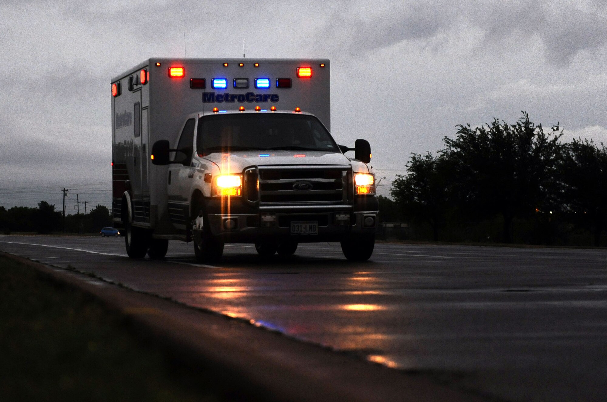 DYESS AIR FORCE BASE, Texas—An ambulance approaches the main gate May 13, here.  Metro Care ambulatory vehicles are authorized by 7th Security Forces Squadron, access on to the installation in support of emergencies that require quick medical response. (U.S. Air Force photo/ Senior Airman Domonique Washington)