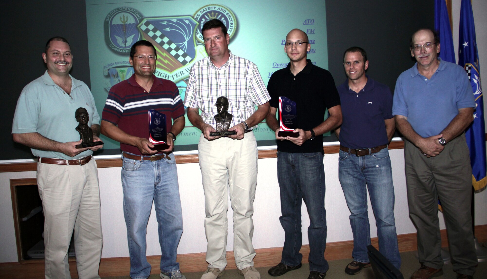 The 482nd Fighter Wing's environmental flight members recieve the 2009 General Thomas D. White Environmental Quality Award and General Thomas D. White Pollution Prevention Award for Team Excellence on May 5. Pictured from left, Larry Ventura, Tony Cedeno, Tim Driscoll, Roger Ramos, Robert Vespe and Mike Andrejko. (U.S. Air Force photo/Tim Norton)