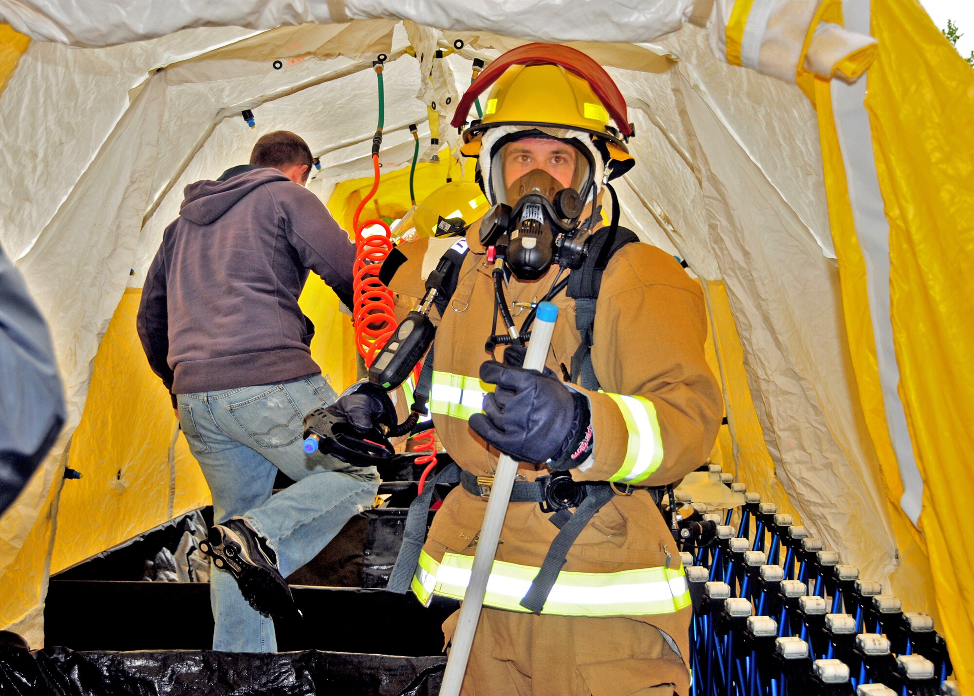 The Niagara Falls Air Reserve Station Fire Department lends support during a simulated chemical spill exercise at the Rainbow Bridge, May 12, 2010, Niagara Falls, NY. The Rainbow Bridge was closed to international travel during the multi agency drill where members of the Niagara Falls Air Reserve Station Fire Department set up a mobile decontamination facility. (U.S. Air Force photo by Staff Sgt. Joseph McKee)