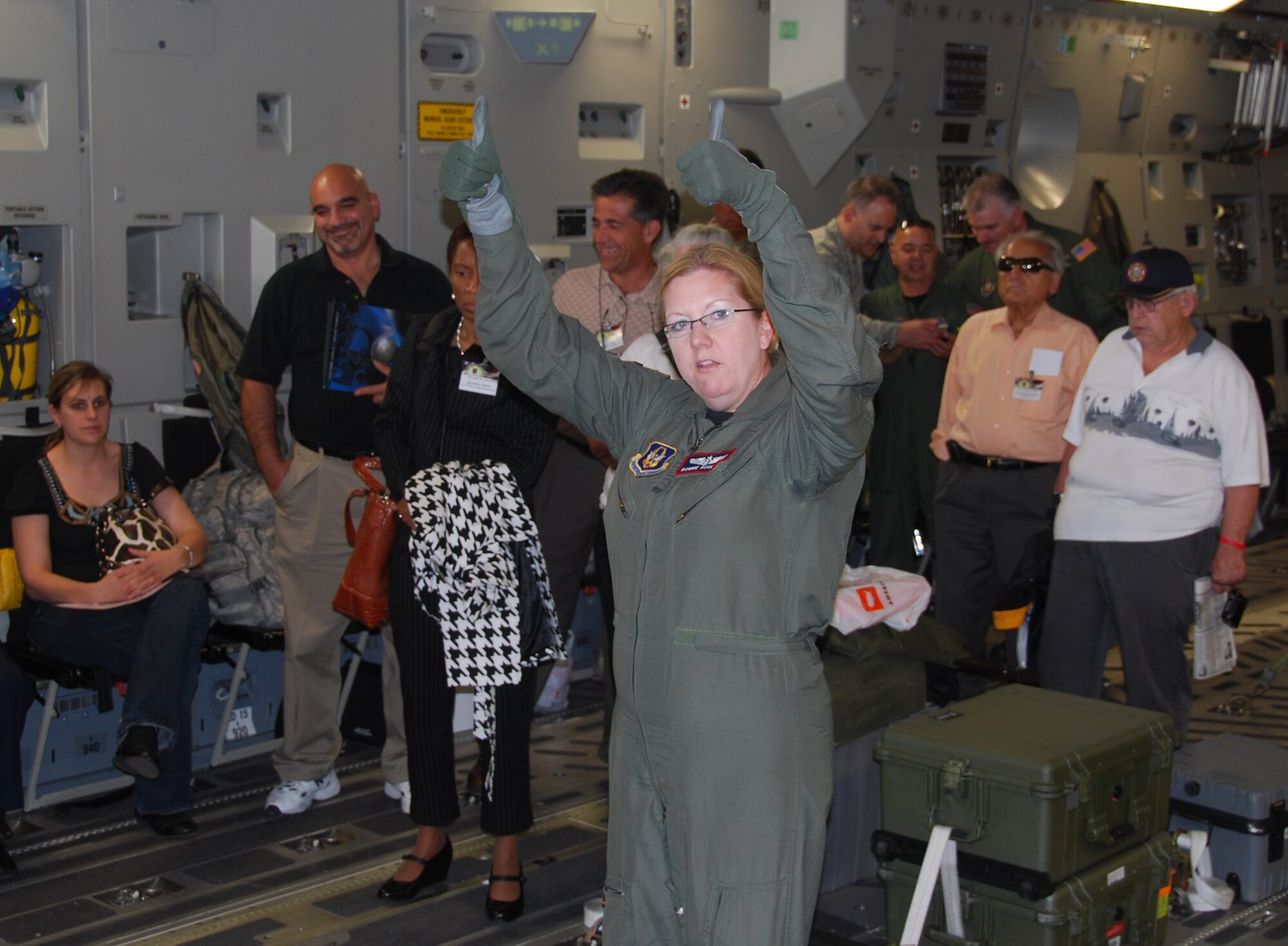 JOINT BASE MCGUIRE-DIX-LAKEHURST, N.J. - Maj. Bonnie Bosler, an Air Force Reserve flight nurse, here, gives the signal for her medical crew to demonstrate a patient on-load on the C-17 Globemaster III, to participants of the civic leader tour held May 4-5. The event provided key civilian members of the Joint Base McGuire-Dix-Lakehurst regional community with a broader view of the Air Force Reserve mission. (U.S Air Force photo/Master Sgt. Donna T. Jeffries) 