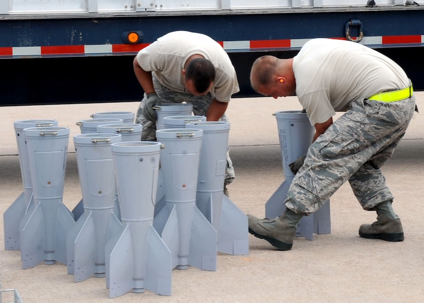 DYESS AIR FORCE BASE, Texas – Airman 1st Class Jesse Bermudez (left) and Senior Airman Virgil Turner, both from the 7th Munitions Squadron, inspect bomb stabilization units May 12 here. The 7th Bomb Wing is one of seven bomb wings to participate in Air Force Global Strike Command’s first load competition. The competition consists of a uniform inspection, general knowledge test, tool inspection, munitions build, weapons load and B-1 Bomber pre-flight inspection. (U.S. Air Force photo/ Airman 1st Class Chelsea Browning)