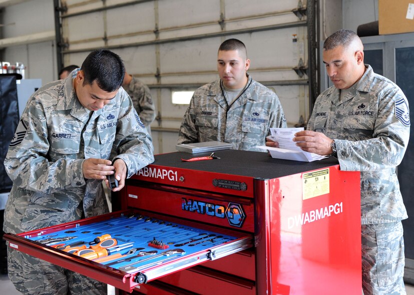 DYESS AIR FORCE BASE, Texas – Global Strike Challenge inspectors Master Sgt. Roger Garrett (left) and Senior Master Sgt. Jules Reimonenq (right) from Barksdale, La., inspect a composite tool kit May 12 here. The 7th Bomb Wing is one of seven bomb wings to participate in Air Force Global Strike Command’s first load competition. The competition consists of a uniform inspection, general knowledge test, tool inspection, munitions build, weapons load and B-1 Bomber pre-flight inspection. (U.S. Air Force photo/ Airman 1st Class Chelsea Browning)