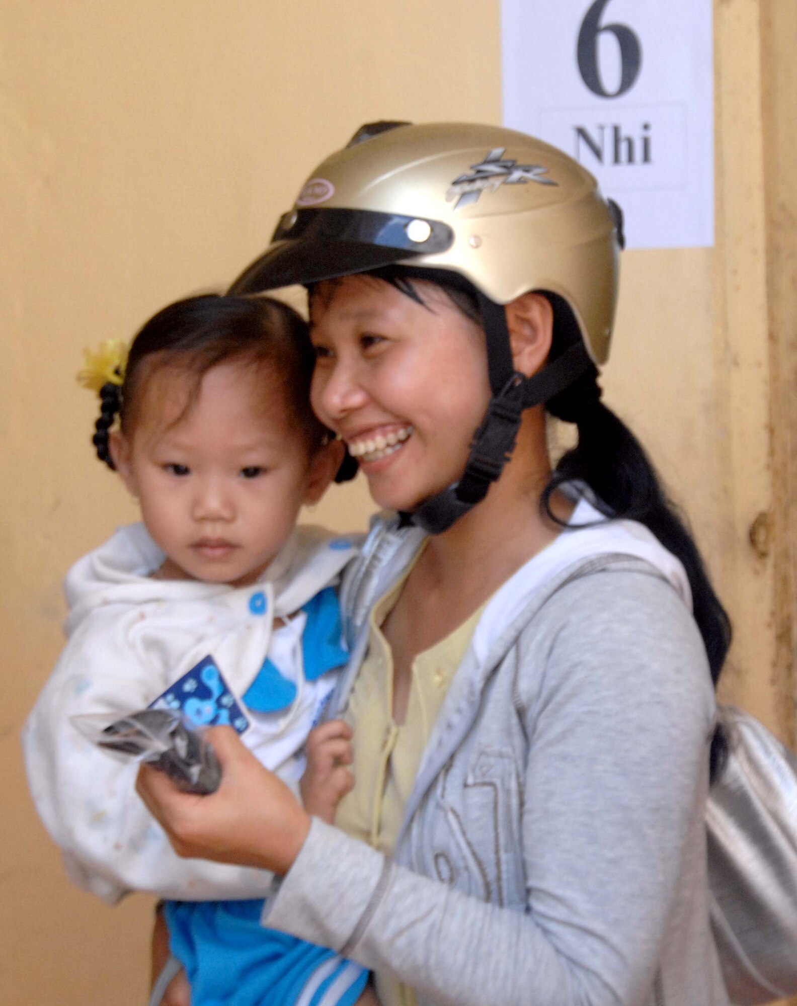 A woman and her daughter receive a free pair of glasses from the optometry clinic at the medical clinic set up at Truong Thanh, Vietnam as part of Pacific Angel 10-2 May 13. Operation Pacific Angel is a joint and combined humanitarian and civic assistance operation conducted in the Pacific area of responsibility to support U.S. Pacific Command's capacity-building efforts. More than 50 U.S. military members are working alongside the Vietnamese military, non-governmental organizations and civil health personnel in medical and engineering efforts during the mission scheduled through May 15. (U.S. Air Force photo/Capt. Timothy Lundberg)