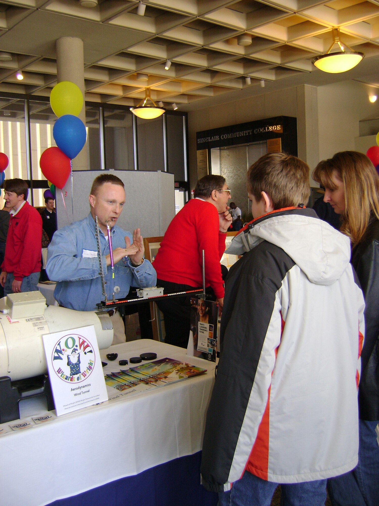 Ron Stauffer from the Air Force Research Laboratory’s Sensors Directorate explains aerodynamics at a Wizards of Wright! booth hosted at the 8th Annual TechFest. 