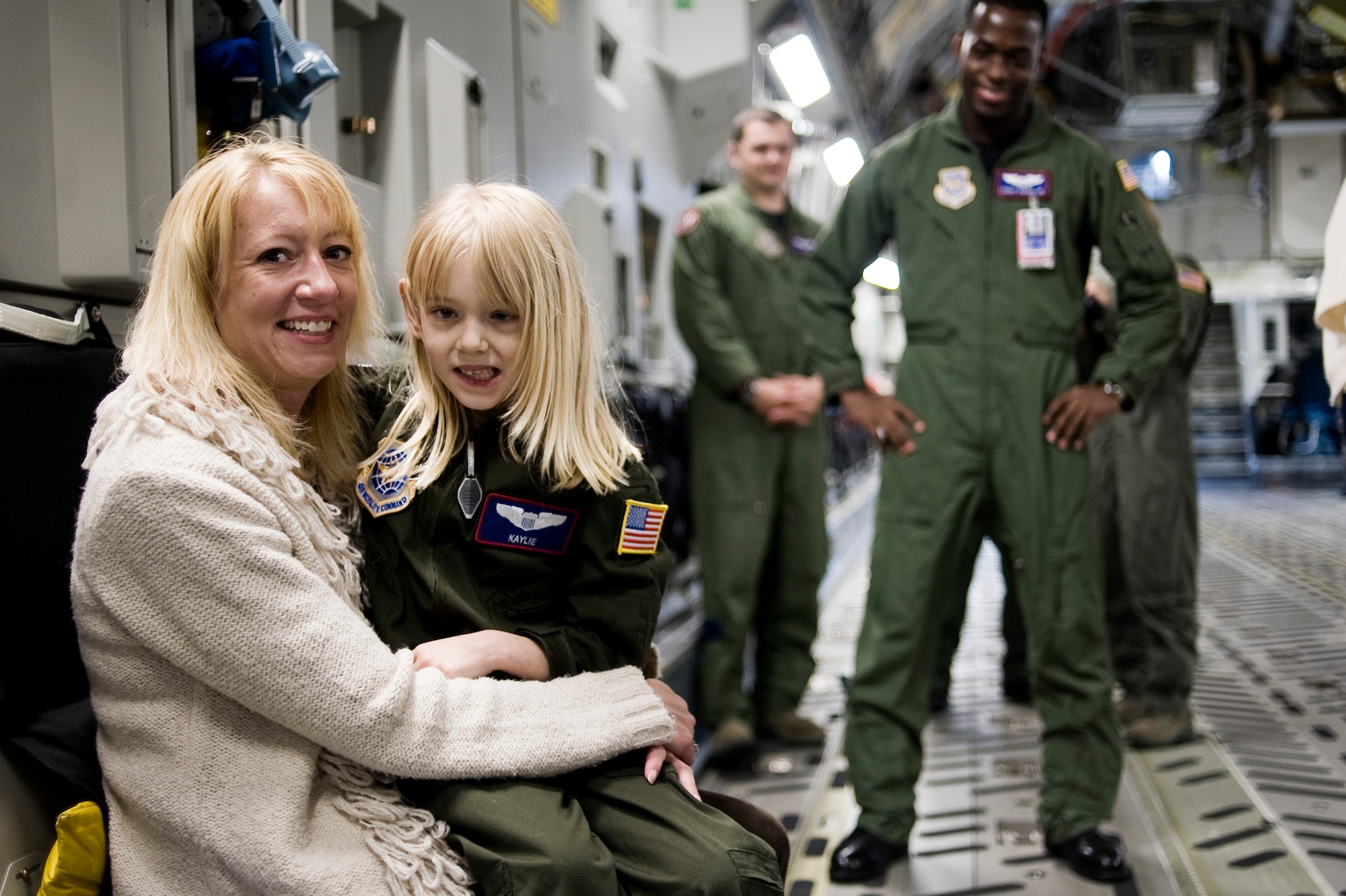 Pilot for a Day candidate Kaylie Bergen, age 6, and her mother Christy pause for a photo while touring a C-17 Globemaster III May 11 as part of McChord Field's Pilot for a Day program. (U.S. Air Force Photo by Abner Guzman)

