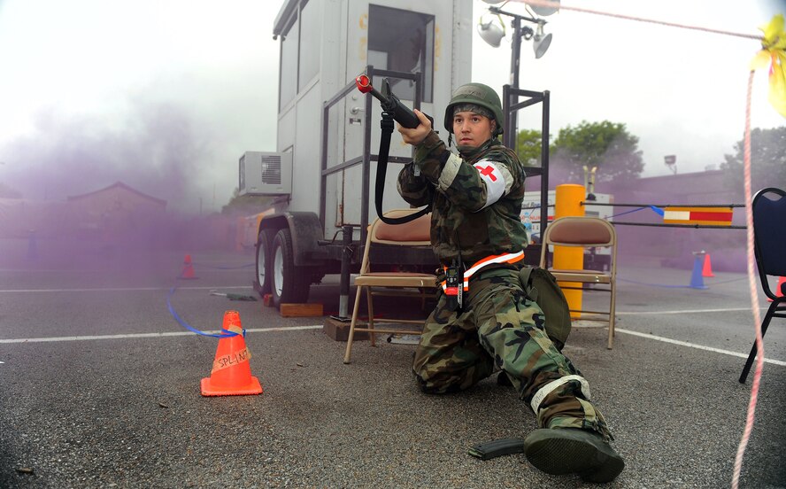 OFFUTT AIR FORCE BASE, Neb. -- Airman 1st Class William Brown, 55th Medical Group, provides cover for fellow Airmen during a simulated attack here May 13 at the gates of Base "X," a simulated base used to simulate a deployed location.  Members of Team Offutt are undergoing extensive training as part of an Operational Readiness Exercise designed to keep Airmen ready to accomplish the mission at deployed locations around the world. U.S. Air Force Photo by Josh Plueger
