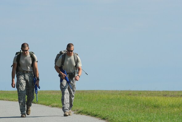 MOODY AIR FORCE BASE, Ga. -- 1st Lt. Daniel Norwood, 822nd Security Forces Squadron Charlie flight commander, and Master Sgt. Michael Miller, 822nd SFS Bravo Flight sergeant, go on a ruck-march during training for the 27th annual David E. Grange Jr. Best Ranger Competition here April 27. The duo will be the first Ranger-qualified Airmen to participate in this competition. (U.S. Air Force photo/Staff Sgt. Elizabeth Rissmiller) 
