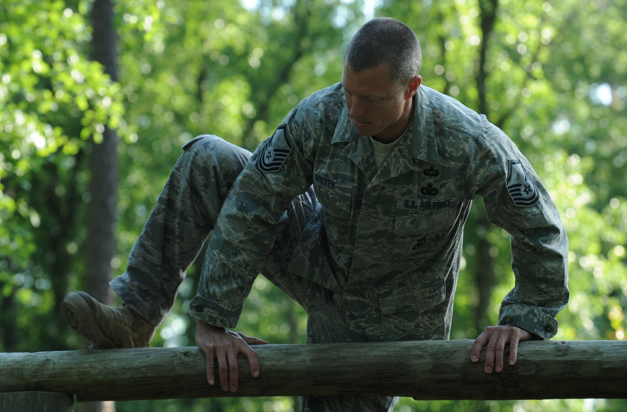 MOODY AIR FORCE BASE, Ga. – Master Sgt. Michael Miller, 822nd Security Forces Squadron Bravo flight sergeant, tackles an obstacle that includes balance beams and monkey bars during training for the 27th annual David E. Grange Jr. Best Ranger Competition here April 27. Lieutenant Norwood and his partner, Master Sgt. Michael Miller, 822nd SFS Bravo flight sergeant, began training in February for the three-day competition. (U.S. Air Force photo by Staff Sgt. Elizabeth Rissmiller/RELEASED)