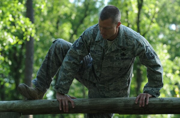 MOODY AIR FORCE BASE, Ga. -- Master Sgt. Michael Miller, 822nd Security Forces Squadron Bravo flight sergeant, tackles an obstacle that includes balance beams and monkey bars during training for the 27th annual David E. Grange Jr. Best Ranger Competition here April 27. Lieutenant Norwood and his partner, Master Sgt. Michael Miller, 822nd SFS Bravo flight sergeant, began training in February for the three-day competition. (U.S. Air Force photo by Staff Sgt. Elizabeth Rissmiller/RELEASED) 