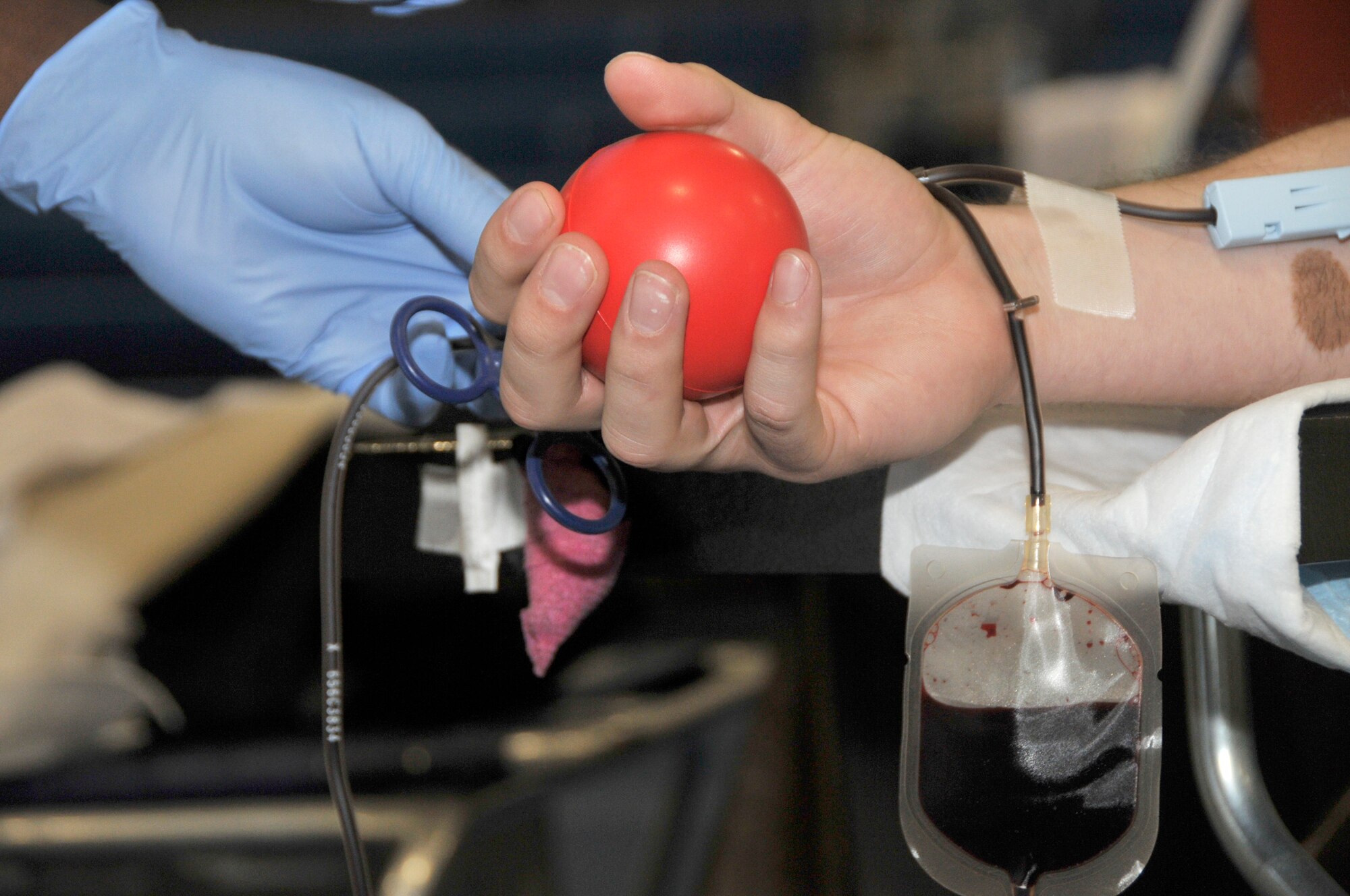 A blood donor participant keeps the blood flowing with a pressure ball at the Armed Services Blood Bank Center-Europe blood drive held at RAF Lakenheath Fitness Center May 11. Personnel from near-by bases came out to donate. (U.S. Air Force photo/Airman 1st Class Eboni Knox)