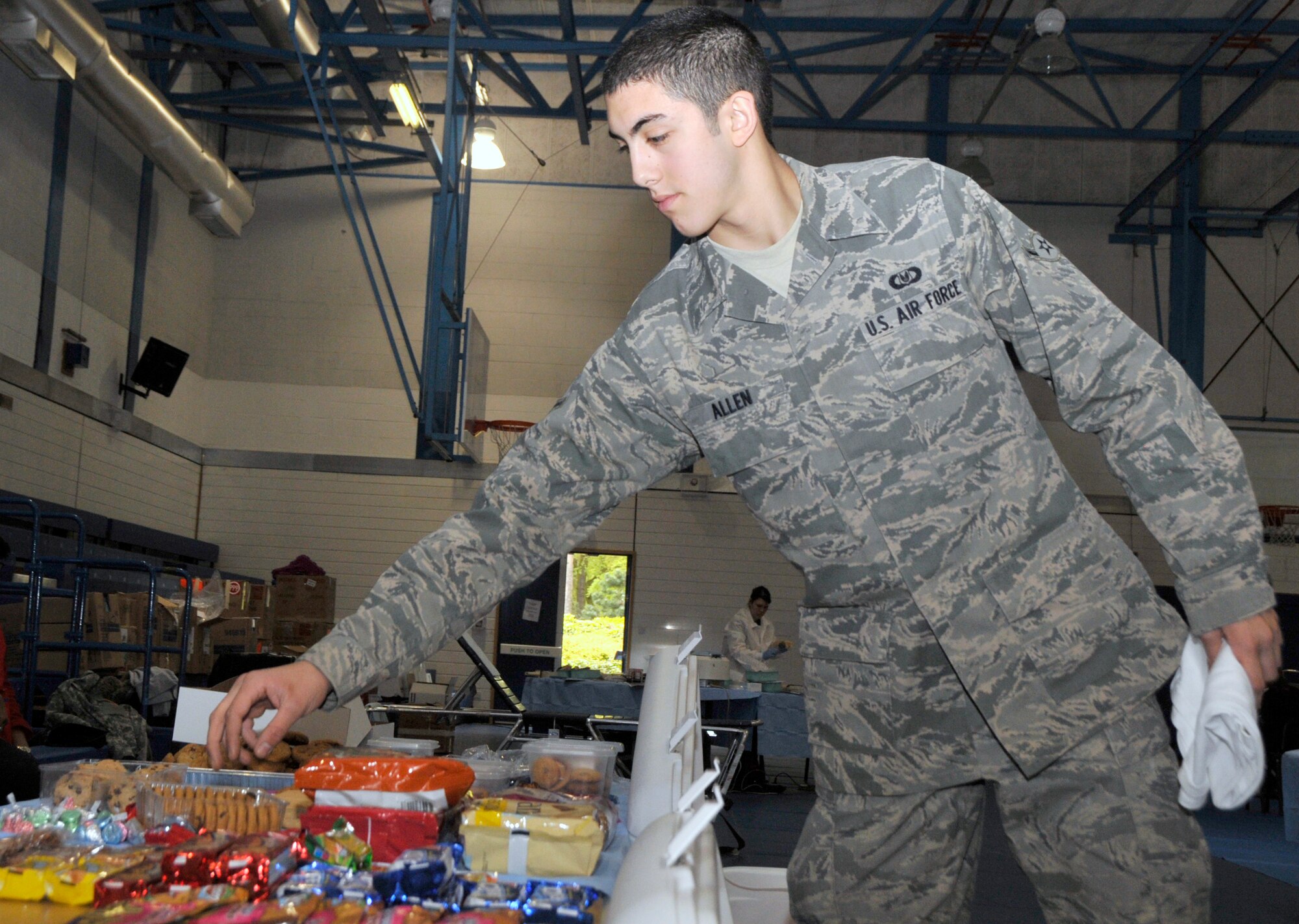 Airman Joshua Allen 100th Operations Support Squadron aircrew flight equipment apprentice, grabs a snack and a mandatory fifteen-minute break after donating at the Armed Services Blood Bank Center-Europe blood drive at RAF lakeheath, England, May 11. Airmen, Soldiers, Sailors, Airmen, DOD civilian personnel and contractors came out to administer the blood drive. (U.S. Air Force photo/Airman 1st Class Eboni Knox)
