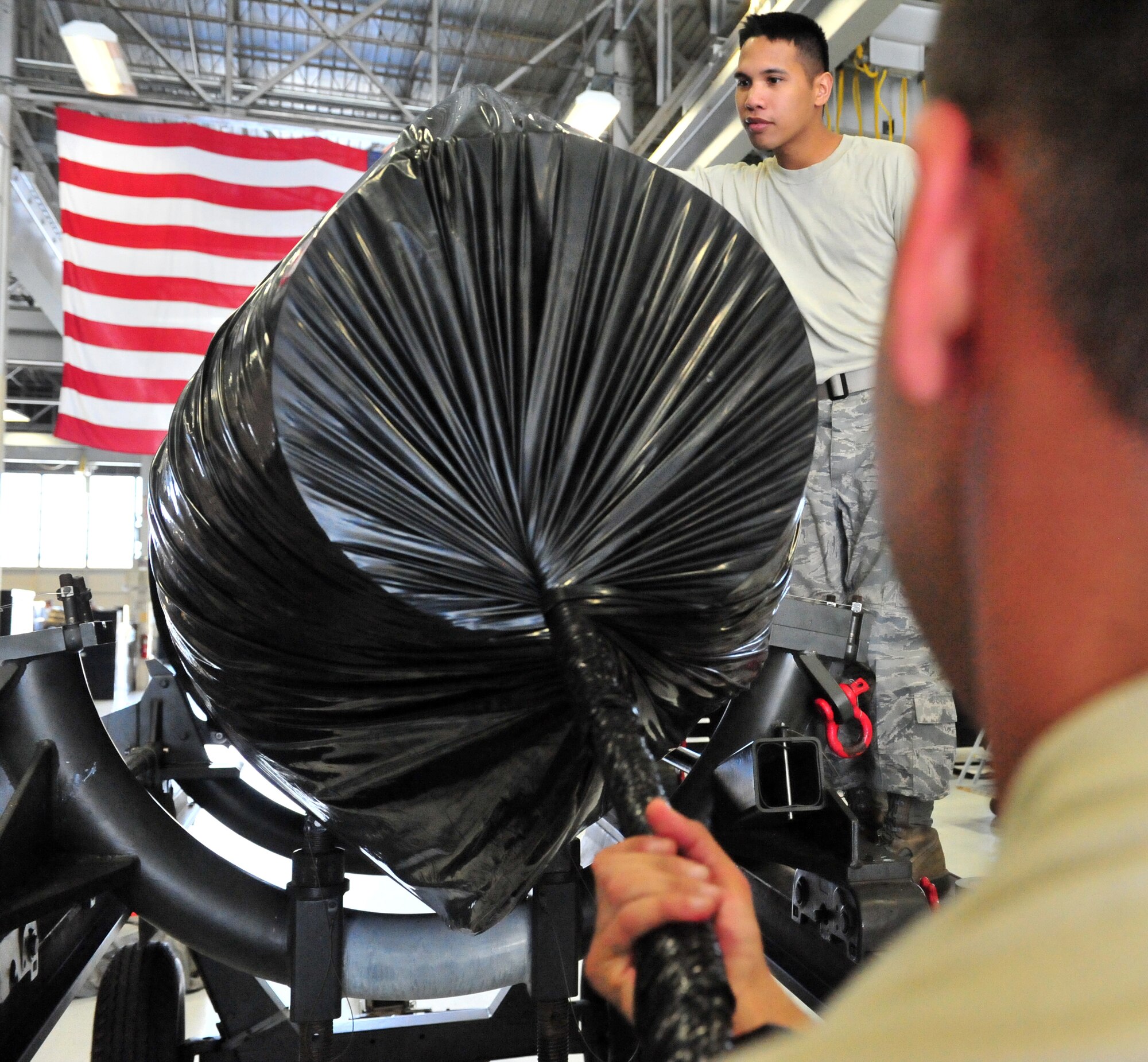 100510-F-6838W-090
SHAW AIR FORCE BASE, S.C. -- Airman 1st Class Mathew Hale (front right) and Staff Sgt. Richard Abisia, 20th Component Maintenance Squadron prepare the final wrapping for the Turbo Fan 34 engine  May 10, 2010. The TF34 engine is the last one to be built at Shaw. (U.S. Air Force photo/Airman 1st Class Neil D. Warner)
