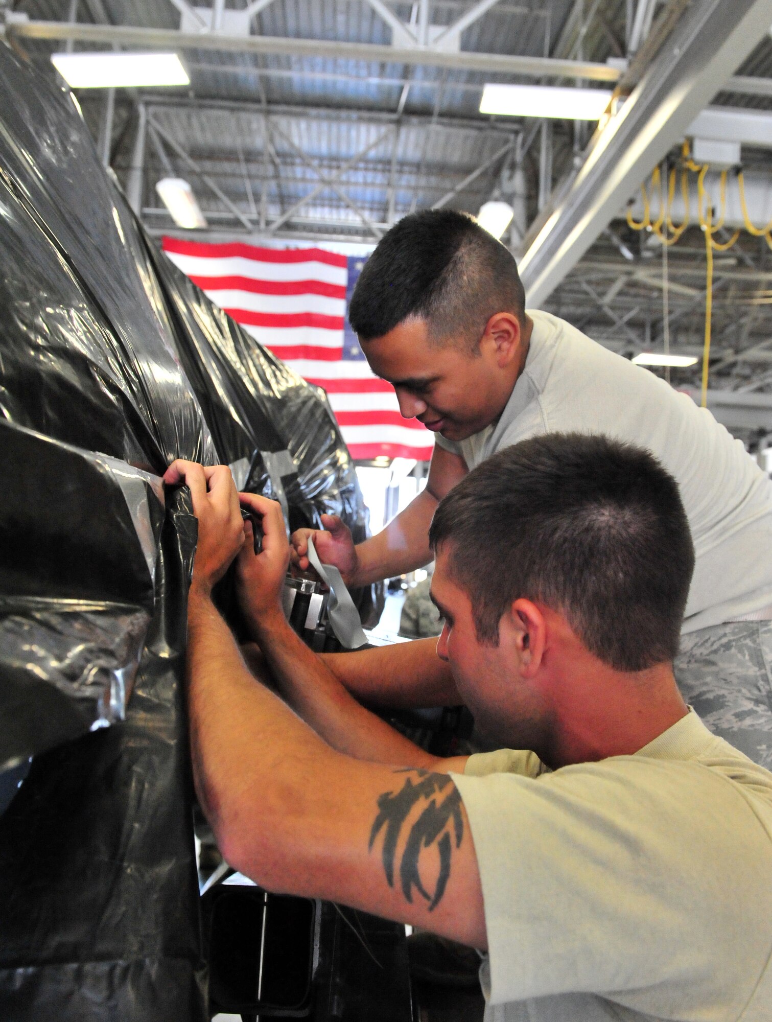 100510-F-6838W-071
SHAW AIR FORCE BASE, S.C. -- 1st Adam Scully (left) and Airman Joseph Silva, both 20th Component Maintenance Squadron aerospace propulsion apprentices prepare the protective wrapping for the Turbo Fan 34 engine  May 10, 2010. The TF34 engine is the last one to be built at Shaw. (U.S. Air Force photo/Airman 1st Class Neil D. Warner)

