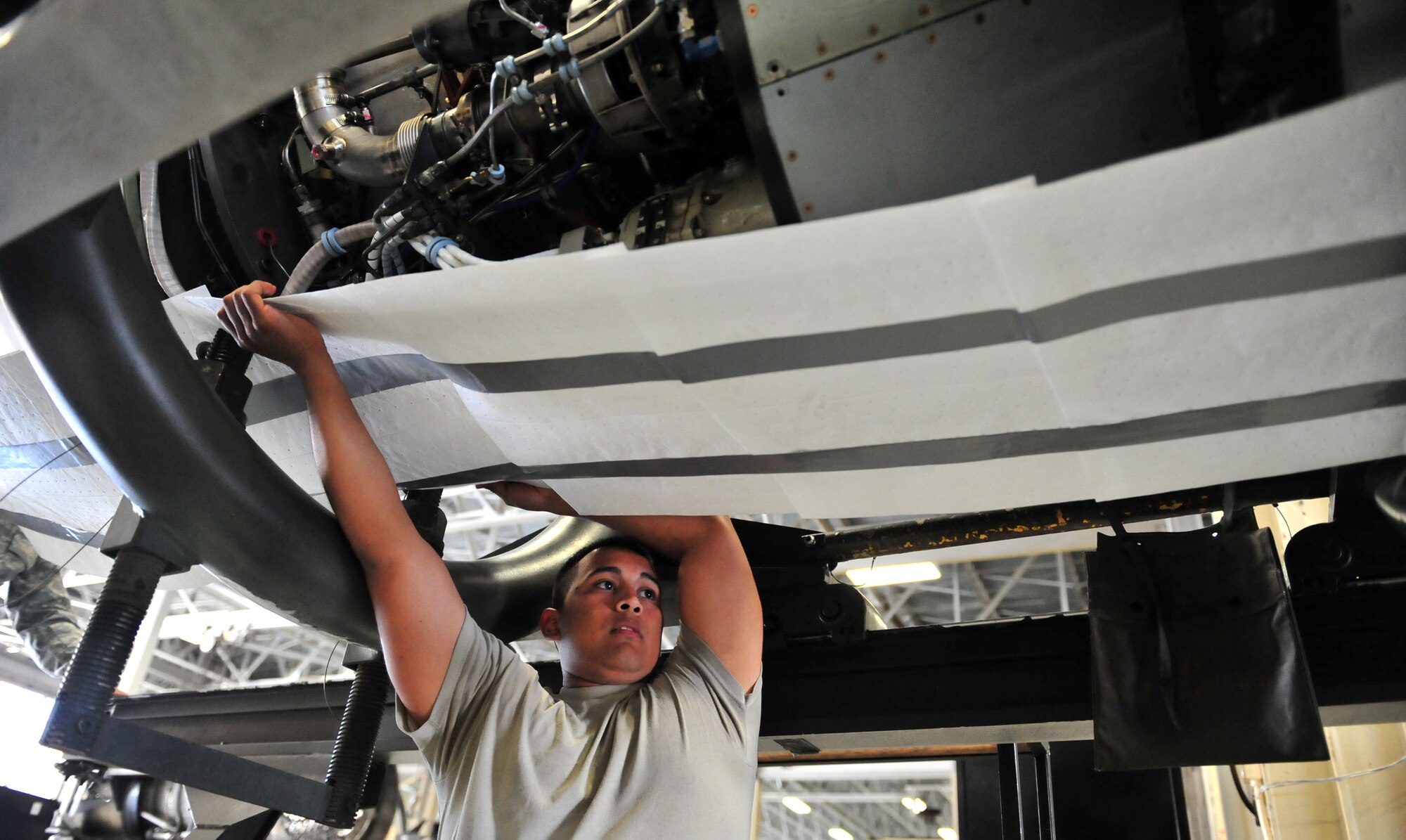 100510-F-6838W-027
SHAW AIR FORCE BASE, S.C. -- Airman 1st Class Fermin Cabrera, 20th Component Maintenance Squadron aerospace propulsion apprentice, prepares the protective wrapping for the Turbo Fan 34 engine May 10, 2010. The TF34 engine is the last one to be built at Shaw. (U.S. Air Force photo/Airman 1st Class Neil D. Warner)