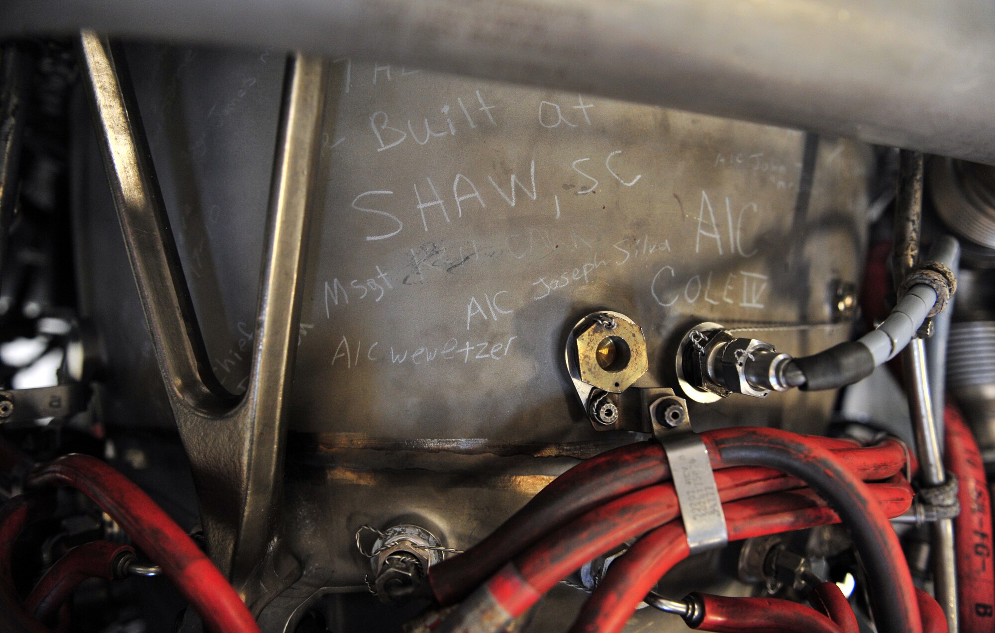 100510-F-6838W-013
SHAW AIR FORCE BASE, S.C. ? Members from the 20th Component Maintenance Squadron sign the Turbo Fan 34 engine for the last farewell May 10, 2010. The TF34 engine shown here is the last one to be built at Shaw. (U.S. Air Force photo/Airman 1st Class Neil D. Warner)