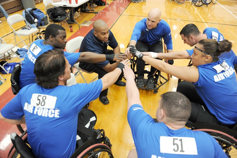 Team Air Force throws their hands in for a quick cheer before playing a wheelchair basketball game during the Warrior Games bronze medal match against the Navy May 12, 2010, at the Olympic Training Center in Colorado Springs, Colo. The Air Force went on to win the game 13-10. (U.S. Air Force photo/Staff Sgt. Desiree N. Palacios)