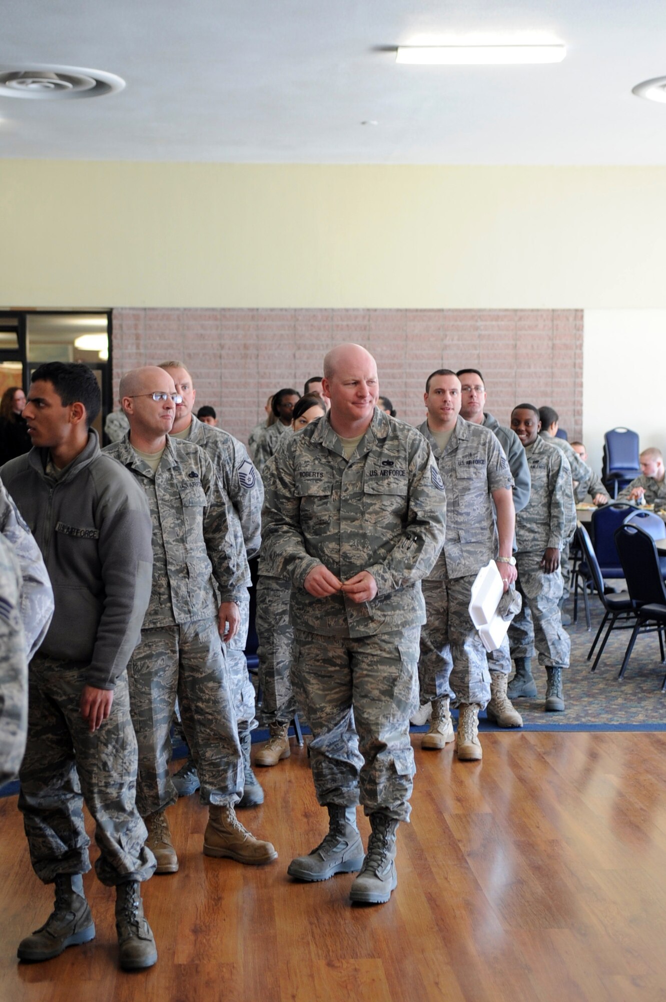 MOUNTAIN HOME AIR FORCE BASE, Idaho – With the promise of interesting fare, Gunfighters line up at the Asian Pacific Heritage taste fest with plates in hand May 7. The taste fest was held at the community activity center on base to help raise awareness and knowledge of the variety of cultures that occupy that region of the world. (U.S. Air Force photo by Airman 1st Class Angelina Drake)