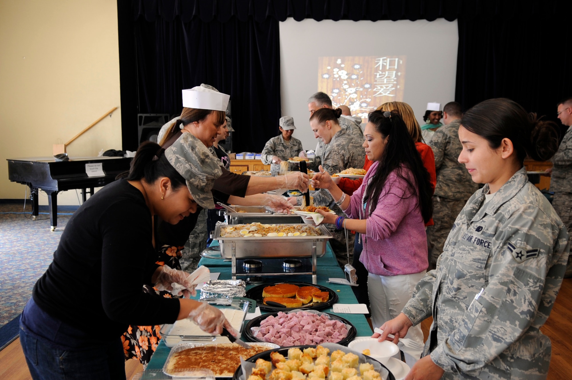 MOUNTAIN HOME AIR FORCE BASE, Idaho – As part of Mountain home’s Asian Pacific Heritage taste fest members of the Asian Pacific Heritage Club serve food to Gunfighters May 7. The taste fest gave Gunfighters the opportunity to taste new and interesting food of the Asian-Pacific region, which in turn generated knowledge and awareness of the different food and cultures that span that region of the globe. (U.S. Air Force photo by Airman 1st Class Angelina Drake)