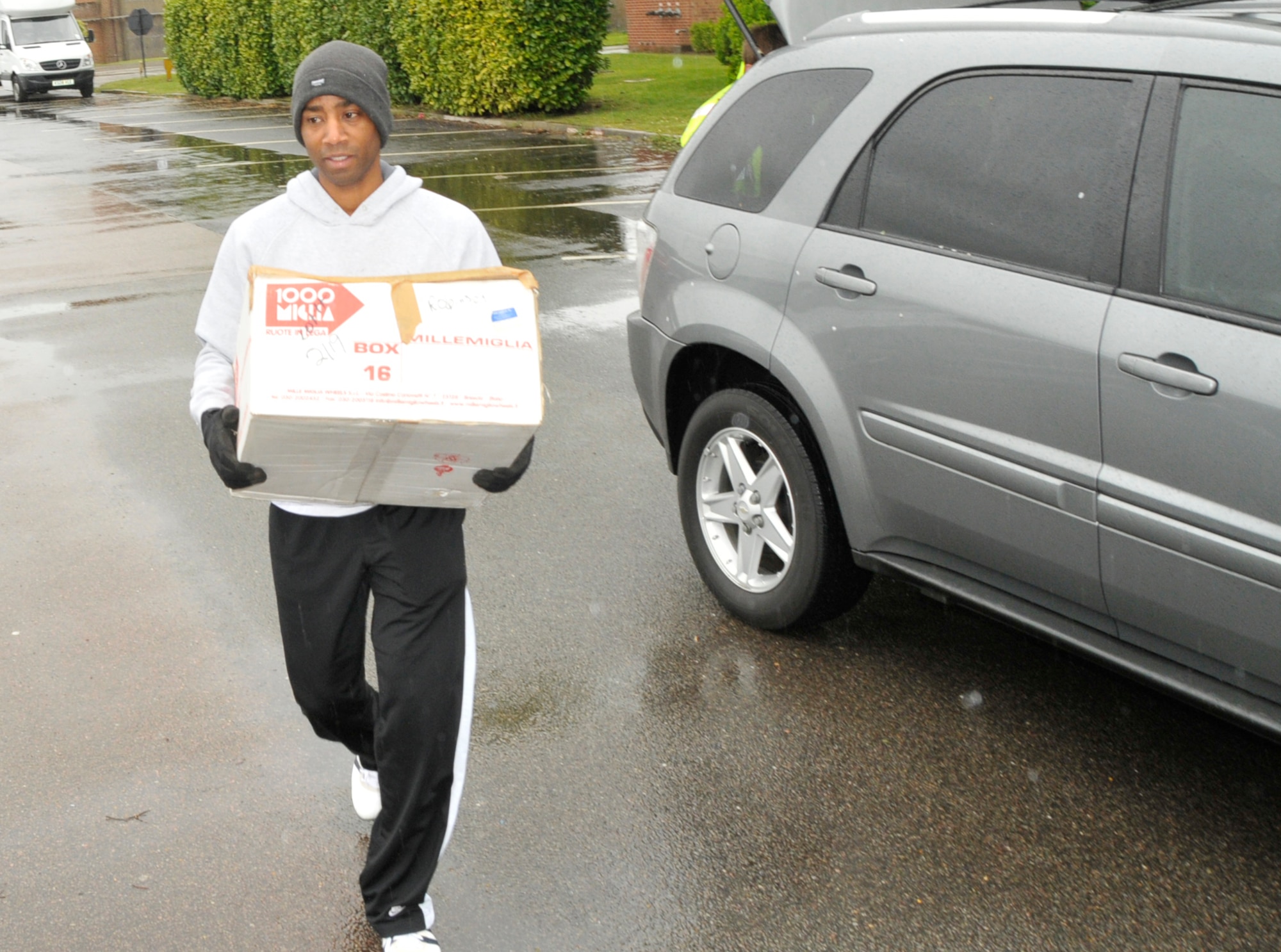 Master Sgt. Alton Robinson, 48th Civil Engineer Squadron assistant chief, drops off an unwanted item into a dumpster on RAF Feltwell as part of the second Military Family Housing Spring Clean-up Day, May 8. Housing residents were invited to bring anything to be disposed of.  Unwanted goods were collected amounting to three metric tons. (U.S. Air Force photo/Airman 1st Class Eboni Knox)
