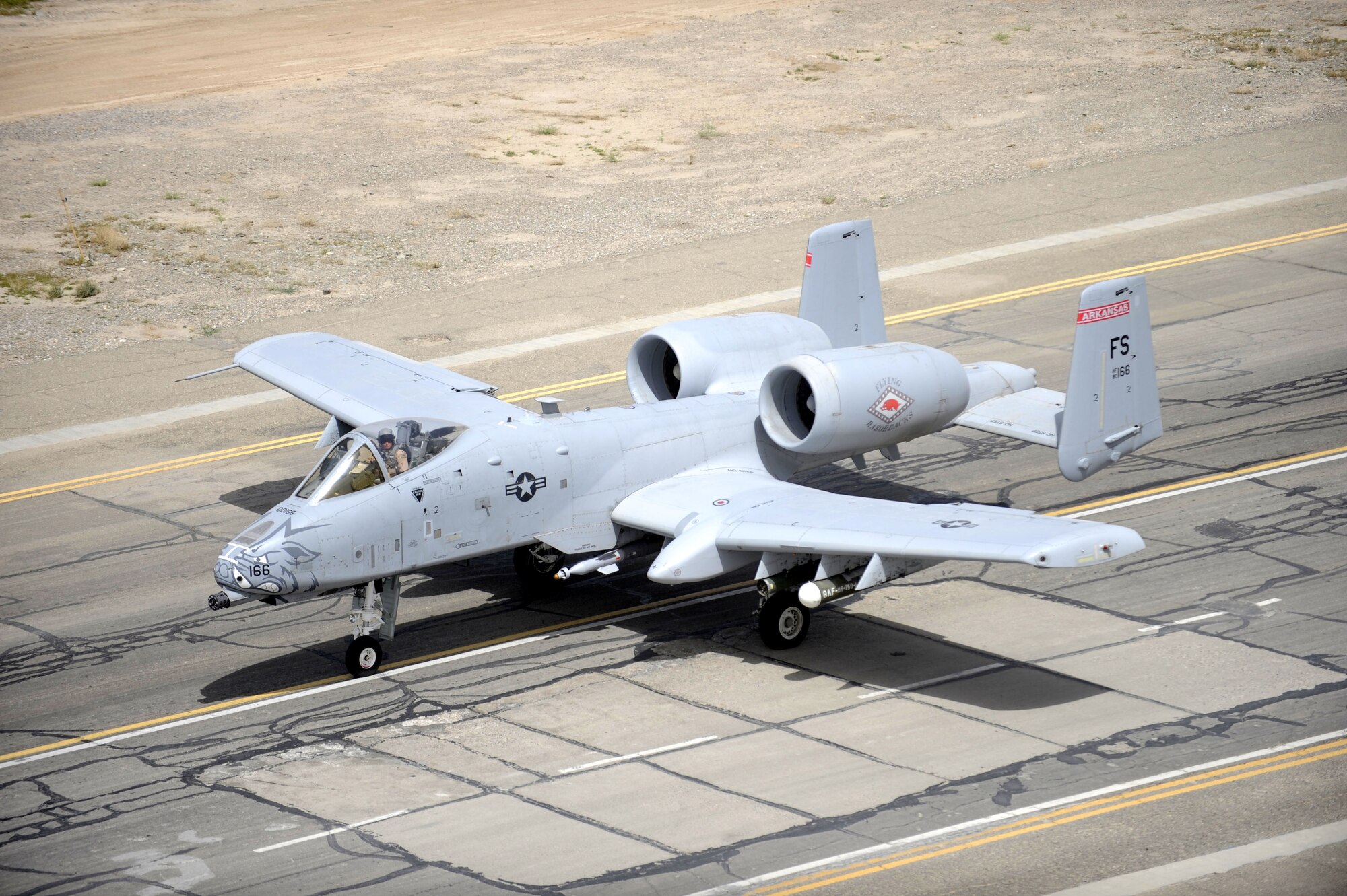An Air Force A-10 Thunderbolt II pilot prepares to take-off on the active runway here March 22.  The A-10 is more commonly known by its nickname "Warthog" or simply "Hog".  The A-10 was designed for close air support (CAS) for ground forces by attacking tanks, armored vehicles, and other ground targets with a limited air interdiction capability.  (U.S. Air Force photo by Senior Airman Nancy Hooks/Released)