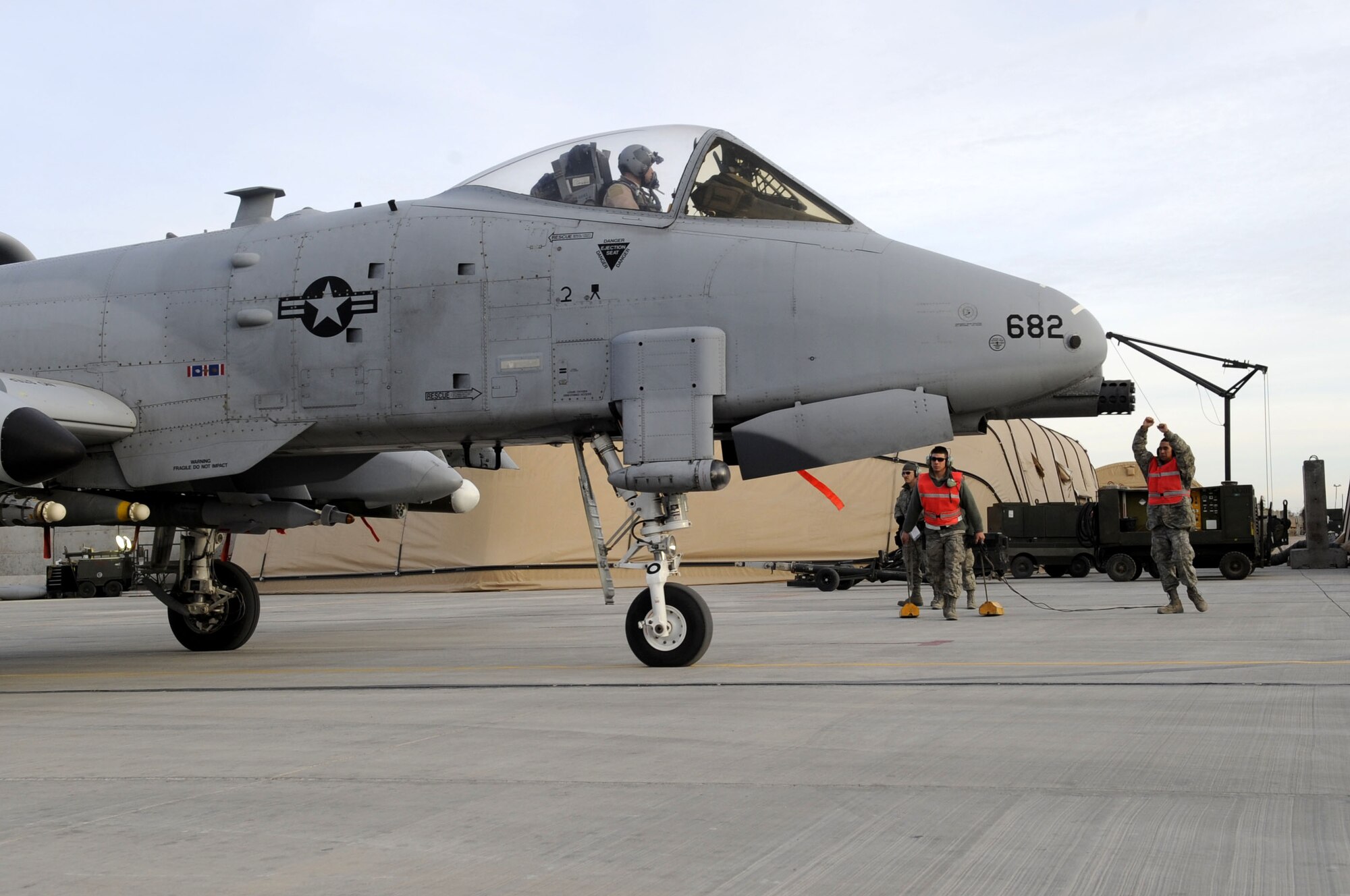 Members from the 451st Expeditionary Aircraft Maintenance Squadron prepare the A-10 Thunderbolt II for take-off Feb. 10.  The A-10 has superior maneuverability at low speeds and altitude, due to large wing area, high wing aspect ratio, and large ailerons.  (U.S. Air Force photo by Senior Airman Nancy Hooks/Released)