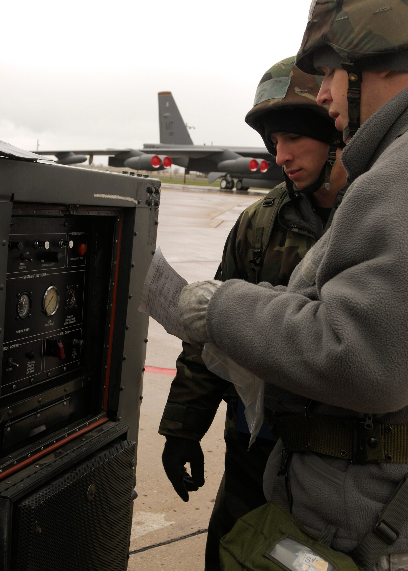 MINOT AIR FORCE BASE, N.D. -- Airman 1st Class Justin Heminger and Staff Sgt. Nathan Jacobson, 5th Aircraft Maintenance Squadron crew chiefs, go through form 244/245 for aircraft ground equipment during the Bomber Strategic Aircraft Recovery Team mobility exercise here May 7. Airman Heminger and Sergeant Jacobson ensured there were no open discrepancies preventing them from using the equipment. (U.S. Air Force photo by Senior Airman Ashley N. Avecilla)