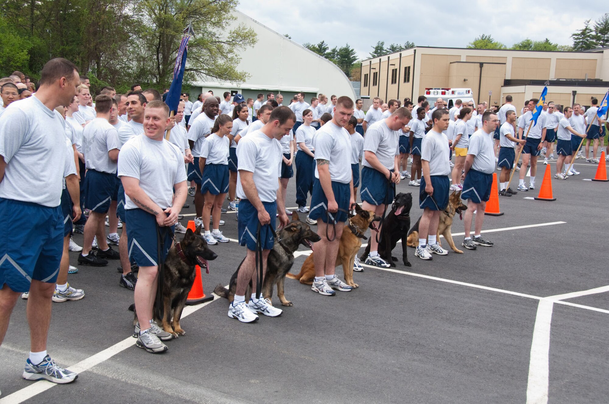 HANSCOM AIR FORCE BASE, Mass. – Airmen prepare for a formation run as part of the opening ceremony for the Hanscom Olympics on May 3. ESC Staff won both the Olympics and the Commander's Cup. The 66th ABW came in second and the 653rd Electronic Systems Wing placed third. (U.S. Air Force photo by Rick Berry)