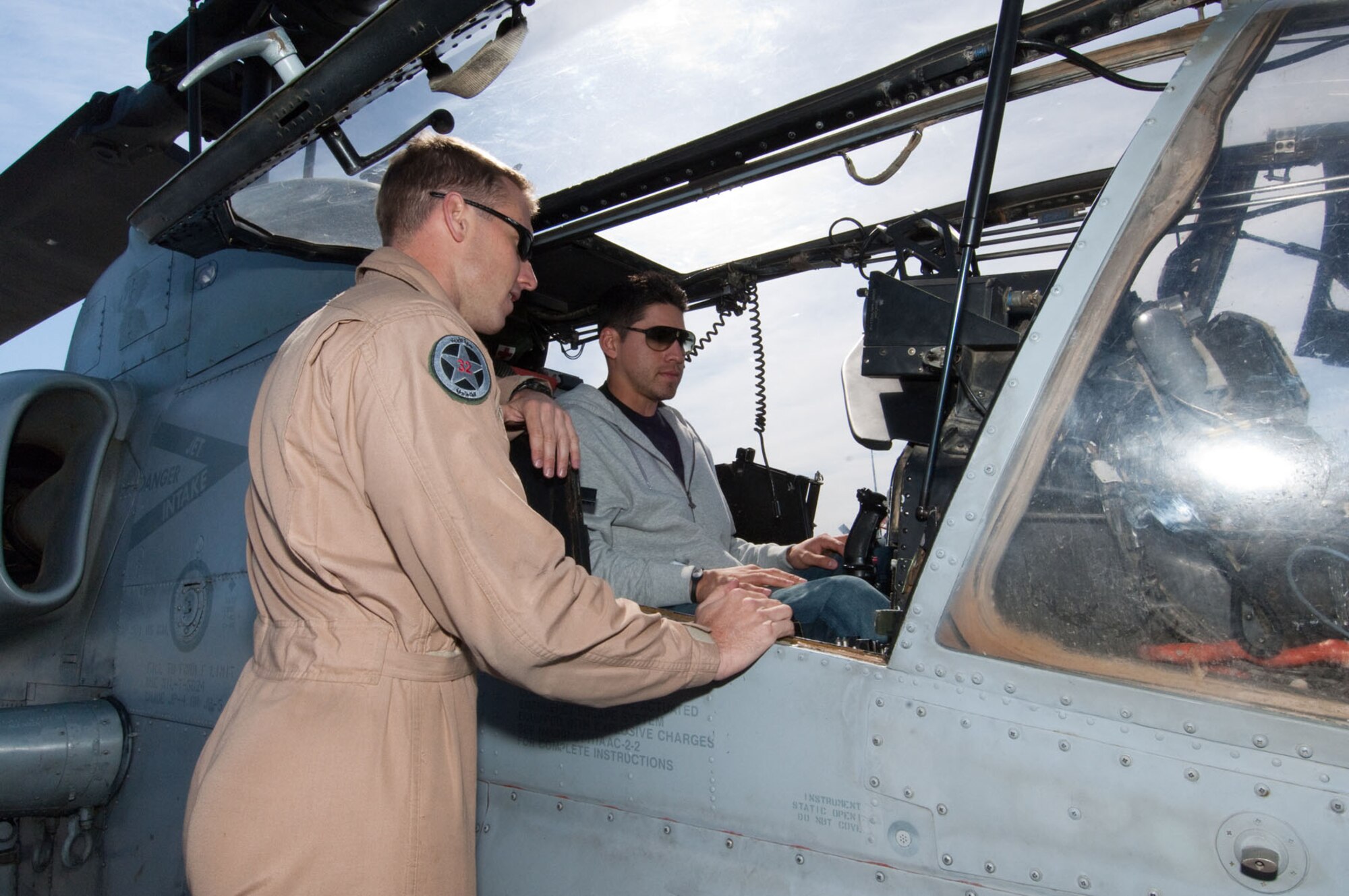 HANSCOM AIR FORCE BASE, Mass. – Red Sox player Jacoby Ellsbury checks out the cockpit of a Marine helicopter stationed on the flight line here. Members of the Red Sox organization visited on May 7 as part of Marine Week Boston activities. (U.S. Air Force photo by Rick Berry)