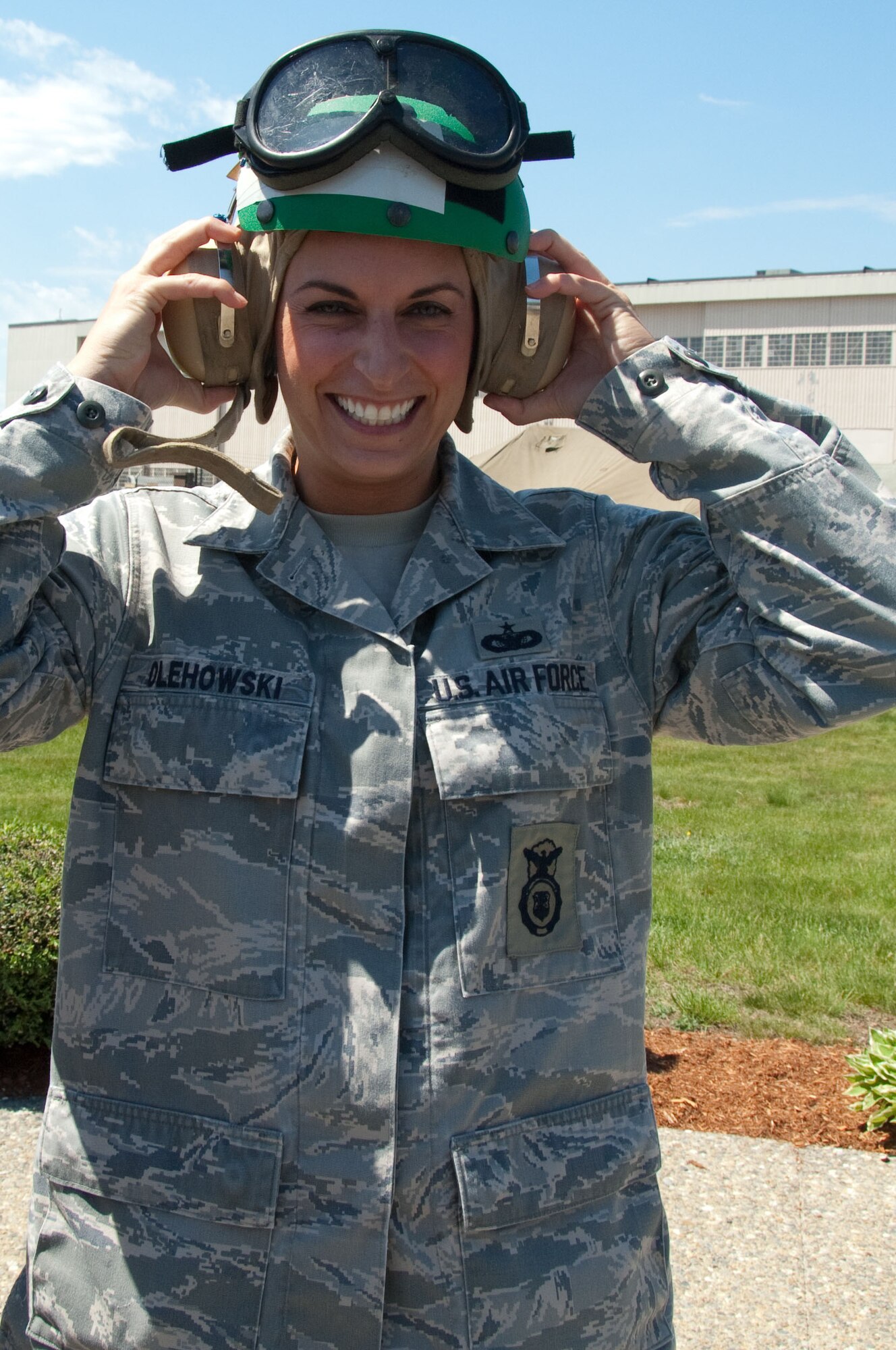HANSCOM AIR FORCE BASE, Mass. – Staff Sgt. Nadia S. Olehowski readies her gear to go on V-22 flight. Sergeant Olehowski was one of several Airmen selected for an incentive flight during media day on May 4 for Marine Week Boston. The Marines staged aircraft and equipment here for Marine Week Boston activities through May 9. (U.S. Air Force photo by Rick Berry)