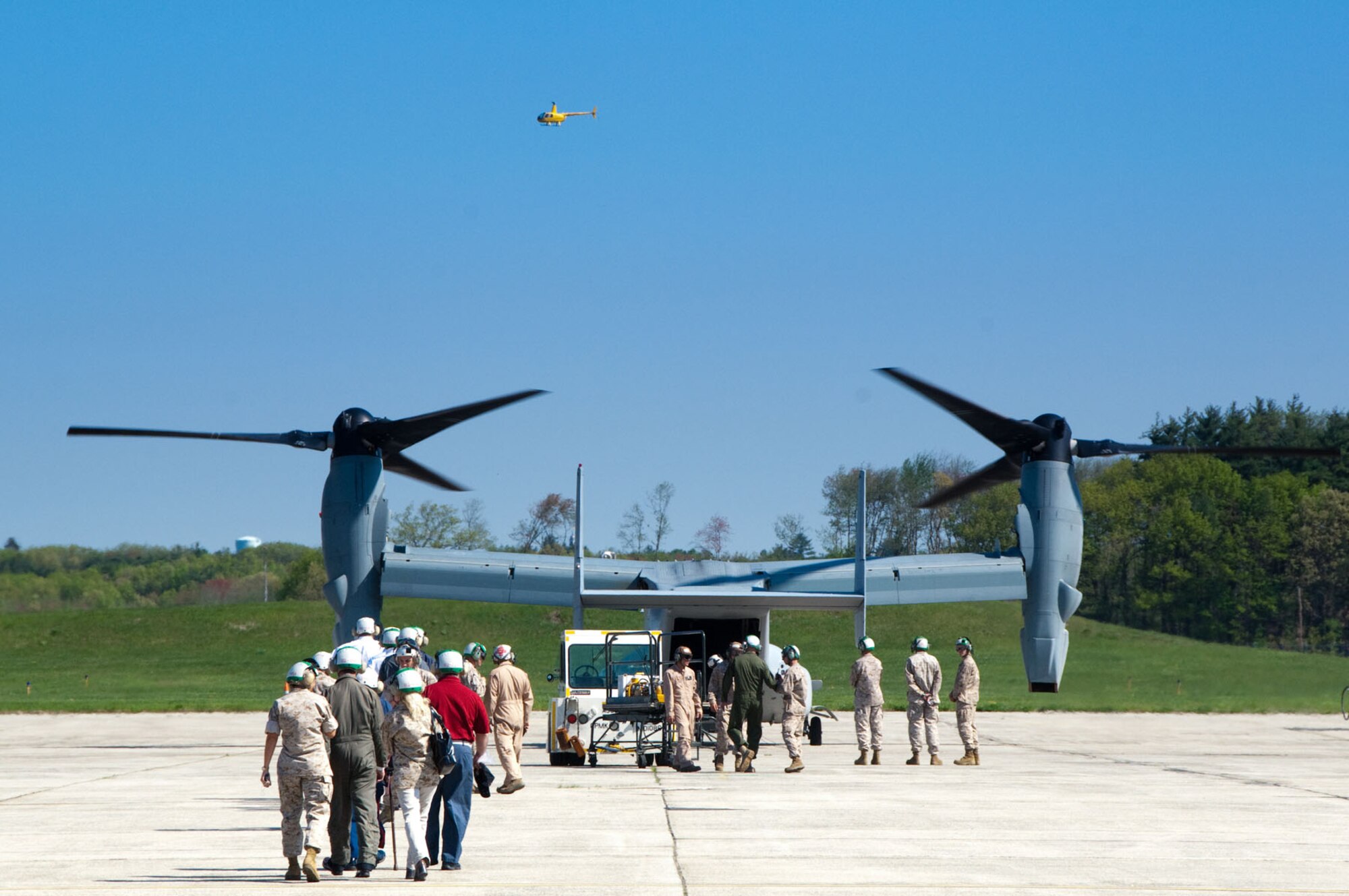 HANSCOM AIR FORCE BASE, Mass. – Participants prepare to board a V-22 Osprey to take a ride over Boston as part of media day on May 4 for Marine Week Boston. The Marines staged aircraft and equipment here for Marine Week Boston activities through May 9. (U.S. Air Force photo by Rick Berry)