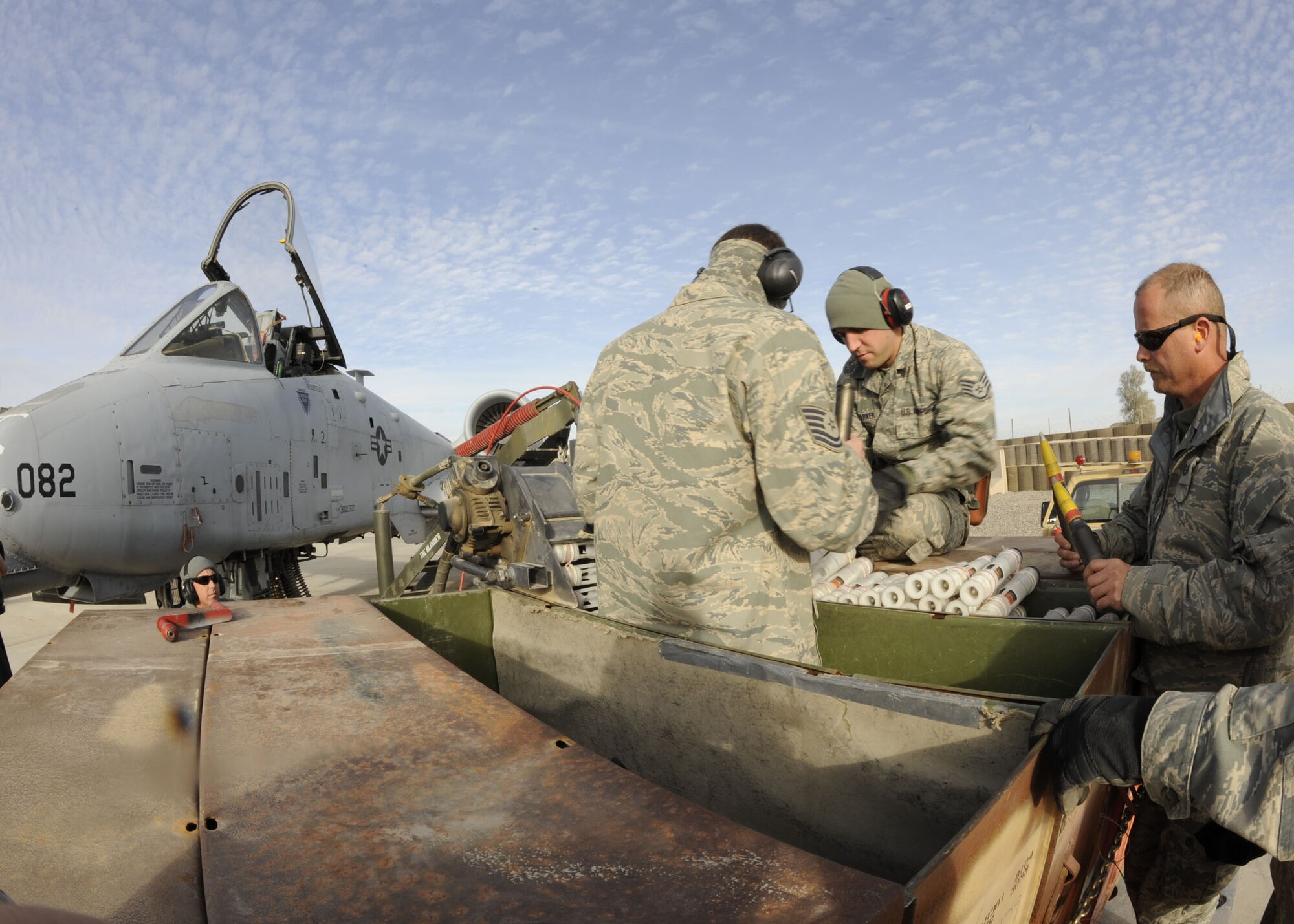 Members from the 451st Expeditionary Aircraft Maintenance Squadron reload the A-10 Thunderbolt II 30mm GAU-8/A Avenger Gatling gun here Feb. 11, 2010.  This is the A-10s primary built-in weapon which can hold up to 1,350 rounds of 30 mm ammunition.  (U.S. Air Force photo by Senior Airman Nancy Hooks/Released)
