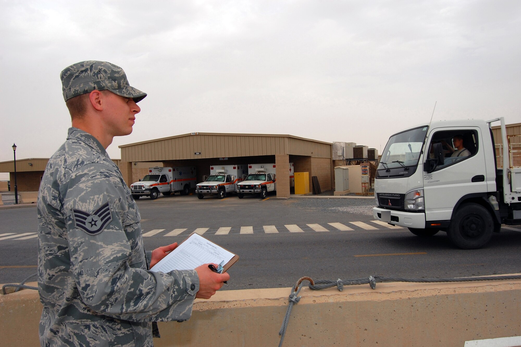 U.S. Air Force Staff Sgt. Nicholas Dziamba, 386th Air Expeditionary Wing ground safety technician, conducts a seatbelt inspection of inbound and outbound traffic May 12, 2010 at an air base in Southwest Asia. Ground safety members conduct weekly seatbelt inspections around the base. (U.S. Air Force photo by Staff Sgt. Lakisha A. Croley/Released)