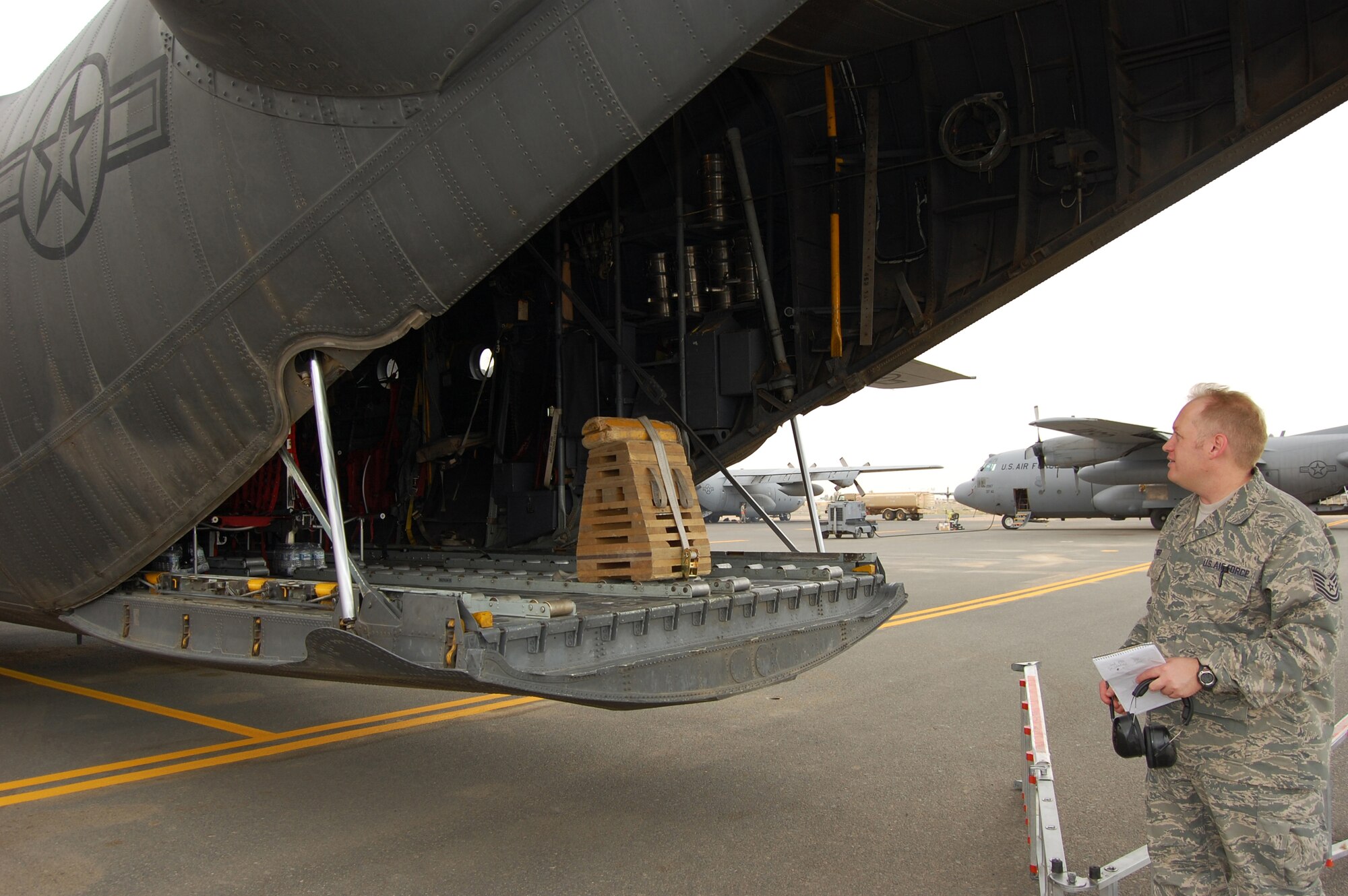 U.S. Air Force Tech. Sgt. Jeff Forer, 386th Air Expeditionary Wing Flight Safety NCO in charge, conducts a spot inspection on a C-130 Hercules May 12, 2010 at an base in Southwest Asia. The NCO conducts about 20 spot inspections of flightline operations a week to ensure members are complying with standardized procedures. (U.S. Air Force photo by Staff Sgt. Lakisha A. Croley/Released)