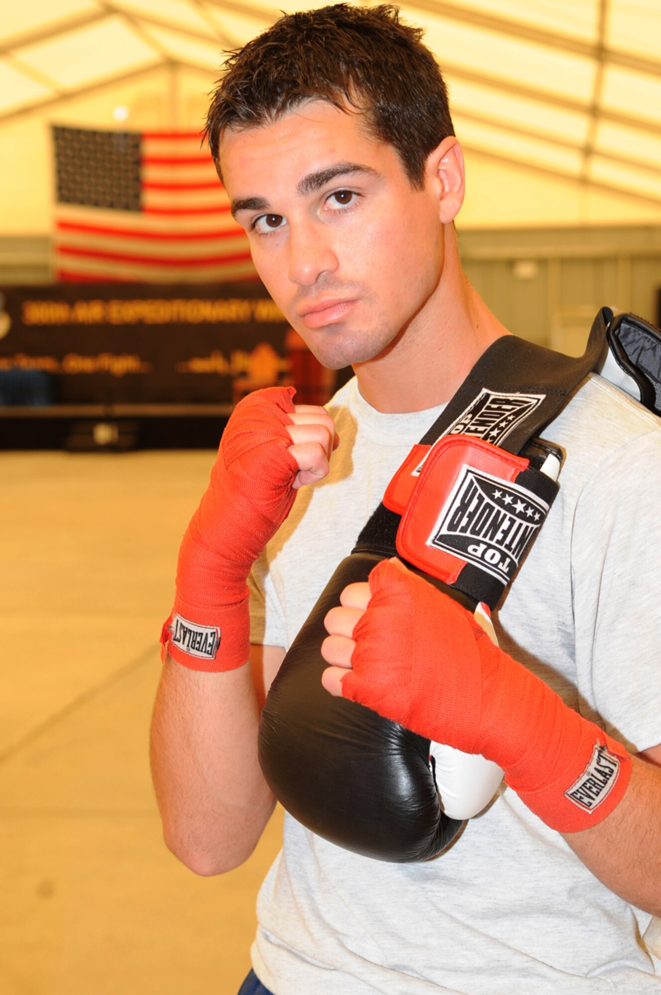 The Air Force's number one featherweight boxing champion, Capt. James Barber, air weapons officer on the E-3 Sentry Airborne Warning and Control System aircraft, 965th Expeditionary Airborne Air Control Squadron, after a training session for an upcoming competition. He's been deployed to an undisclosed location in Southwest Asia from January 2010 - May 2010. He deployed from the 965th Airborne Air Control Squadron at Tinker Air Force Base, Okla. (U.S. Air Force photo/Capt. Cathleen Snow/Released)