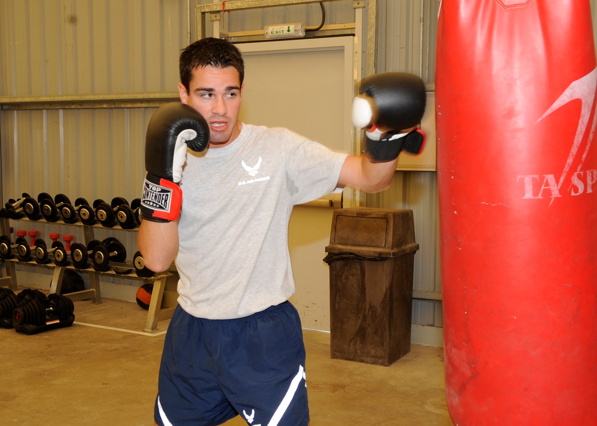 The Air Force's number one featherweight boxing champion, Capt. James Barber, air weapons officer on the E-3 Sentry Airborne Warning and Control System aircraft, 965th Expeditionary Airborne Air Control Squadron, gets ready for an upcoming competition after he redeploys in June 2010. He is deployed to an undisclosed location in Southwest Asia from January 2010 - May 2010 from 965th Airborne Air Control Squadron at Tinker Air Force Base, Okla. (U.S. Air Force photo/Capt. Cathleen Snow/Released)
