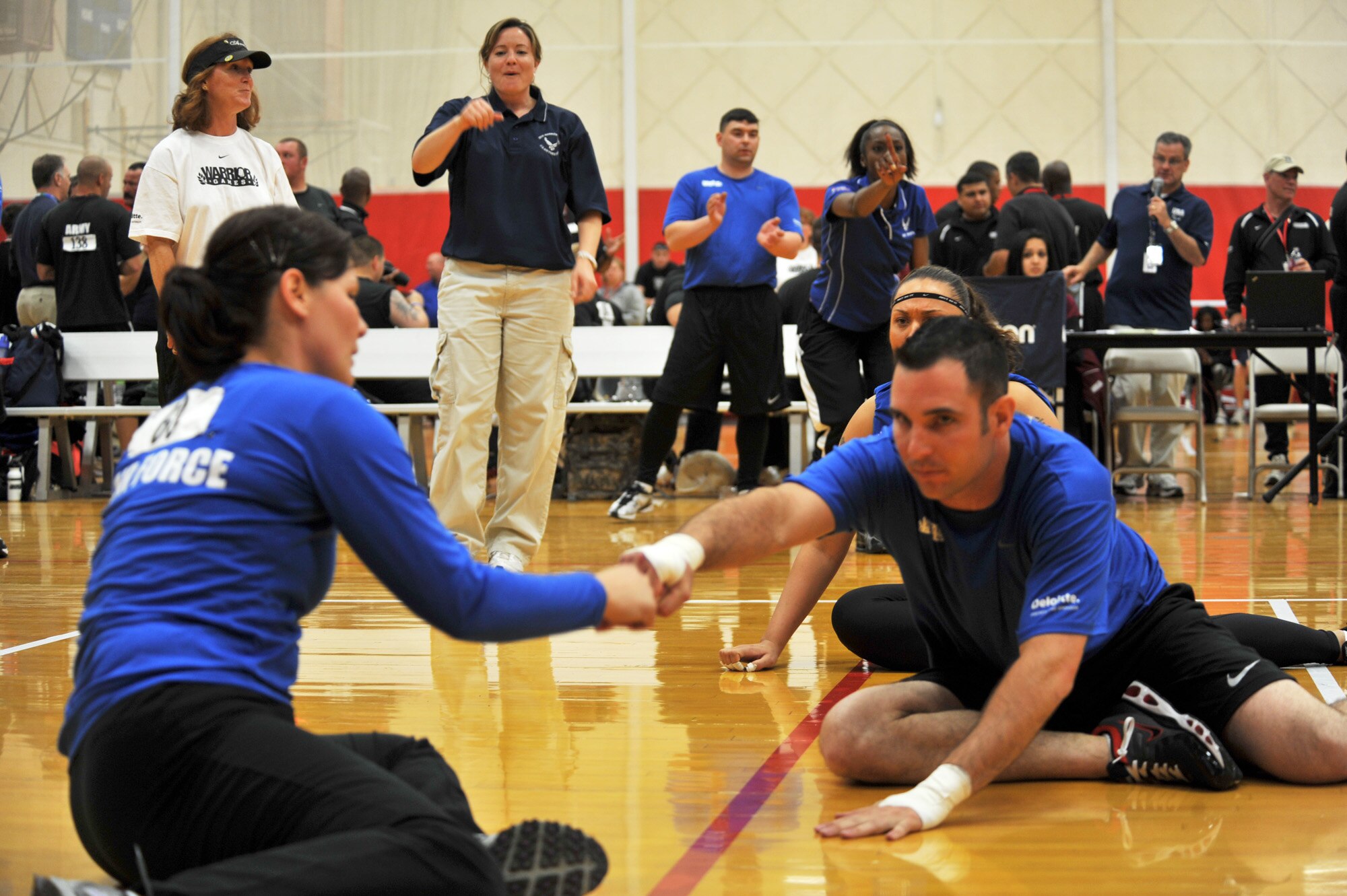 Capt. Nicki Marino and Tech. Sgt. Elisha Abercrombie yell out to the Air Force team that they need one more point to win during the Warrior Games volleyball match against the Army May 12, 2010 at the Olympic Training Center, Colorado Springs. The Air Force went on to win the game 15-7. The Warrior Games competition began May 10 and finishes on May 14, 2010 at the U.S. Olympic Training Center in Colorado Springs. (U.S. Air Force photo/Staff Sgt. Desiree N. Palacios)