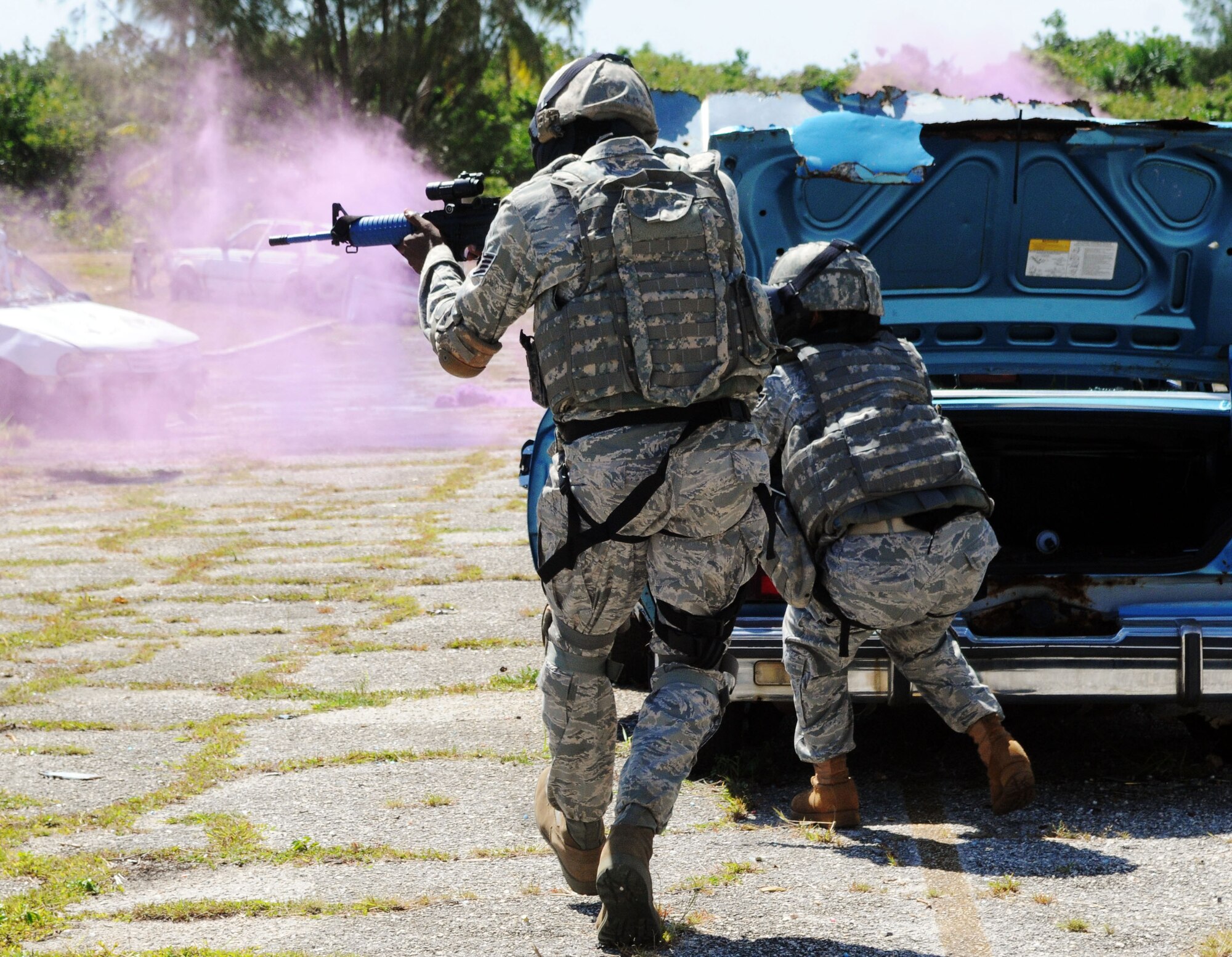 ANDERSEN AIR FORCE BASE, Guam ? Senior security forces personnel from the Pacific Air Forces and 13th Air Force co-hosted the Subject Matter Expert Exchange (SMEE) May 10-13 here. The SMEE is a multinational military information sharing event that provides a forum for mid-level officers from regional security services to exchange views and establish international and interpersonal relationships. The goal of the exchange is to establish integrated base defense and force protection cooperation with select Asian-Pacific nations. The SMEE is held quarterly and invites two members each from select nations. The latest one featured officers from the nations of Cambodia, Indonesia, and Thailand. The exchange includes briefings by experts in many fields of force protection and security forces, including Air Force Office of Speccial Investigations agents, 36th Security Forces Squadron Commander Maj. Sarah Babbitt, 36th Contingency Response Group Commander Col. Daniel Settergren, and 736th Security Forces Squadron Commander Maj. Kirk Hughes. The SMEE attendees also participated in demonstrations of training and fighting capabilities including the K-9 unit, tactical weapons, and simunitions. (U.S. Air Force photos by Airman 1st Class Julian North)