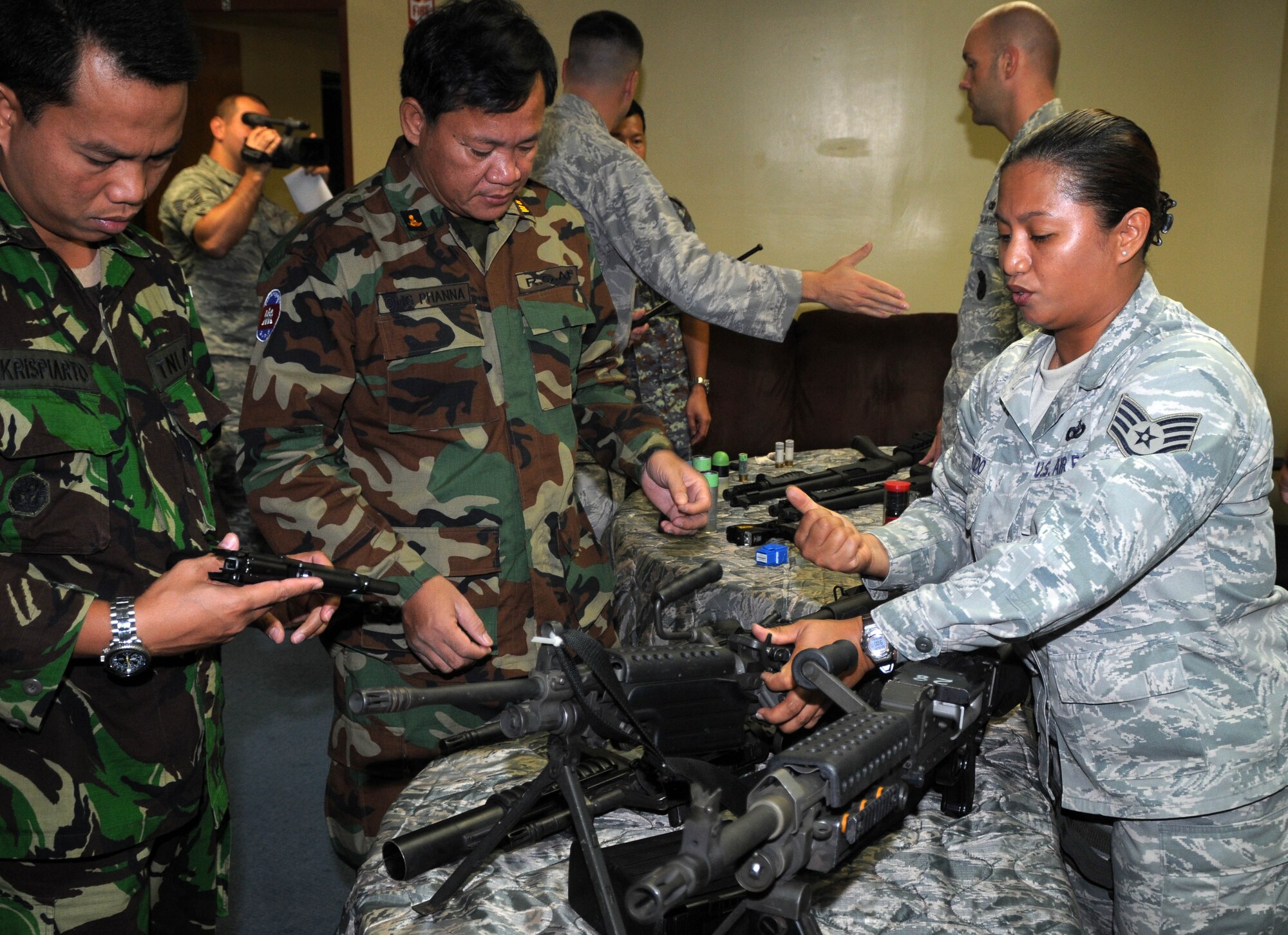 ANDERSEN AIR FORCE BASE, Guam ? Senior security forces personnel from the Pacific Air Forces and 13th Air Force co-hosted the Subject Matter Expert Exchange (SMEE) May 10-13 here. The SMEE is a multinational military information sharing event that provides a forum for mid-level officers from regional security services to exchange views and establish international and interpersonal relationships. The goal of the exchange is to establish integrated base defense and force protection cooperation with select Asian-Pacific nations. The SMEE is held quarterly and invites two members each from select nations. The latest one featured officers from the nations of Cambodia, Indonesia, and Thailand. The exchange includes briefings by experts in many fields of force protection and security forces, including Air Force Office of Speccial Investigations agents, 36th Security Forces Squadron Commander Maj. Sarah Babbitt, 36th Contingency Response Group Commander Col. Daniel Settergren, and 736th Security Forces Squadron Commander Maj. Kirk Hughes. The SMEE attendees also participated in demonstrations of training and fighting capabilities including the K-9 unit, tactical weapons, and simunitions. (U.S. Air Force photos by Airman 1st Class Julian North)