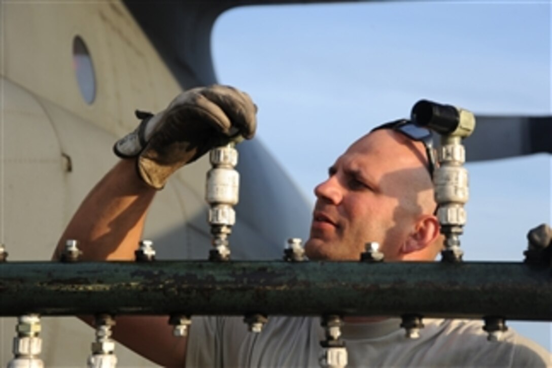 U.S. Air Force Staff Sgt. Jeremy Rogers, an aerial spray aircraft maintainer from the 910th Aircraft Maintenance Squadron, inspects the sprayer on a C-130 Hercules cargo aircraft on the runway of Stennis International Airport, Miss., on May 10, 2010.  The 910th Airlift Wing, the Department of Defense’s only large-area fixed-wing aerial spray unit, is in Mississippi to assist with the Deepwater Horizon oil spill.  