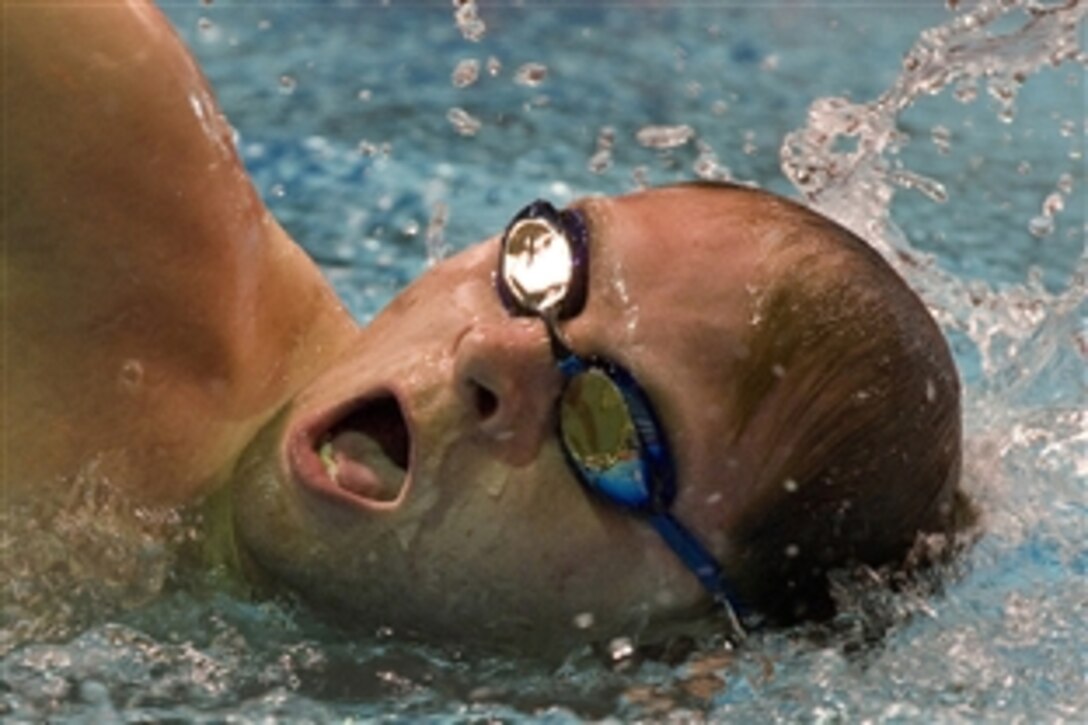 An Army Swimmer competes in the 50-yard free style preliminary meet at the Warrior Games at the Olympic Training Center, Colorado Springs, Colo., May 12, 2010. 